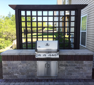 Backyard patio with outdoor kitchen in Pembroke, MA