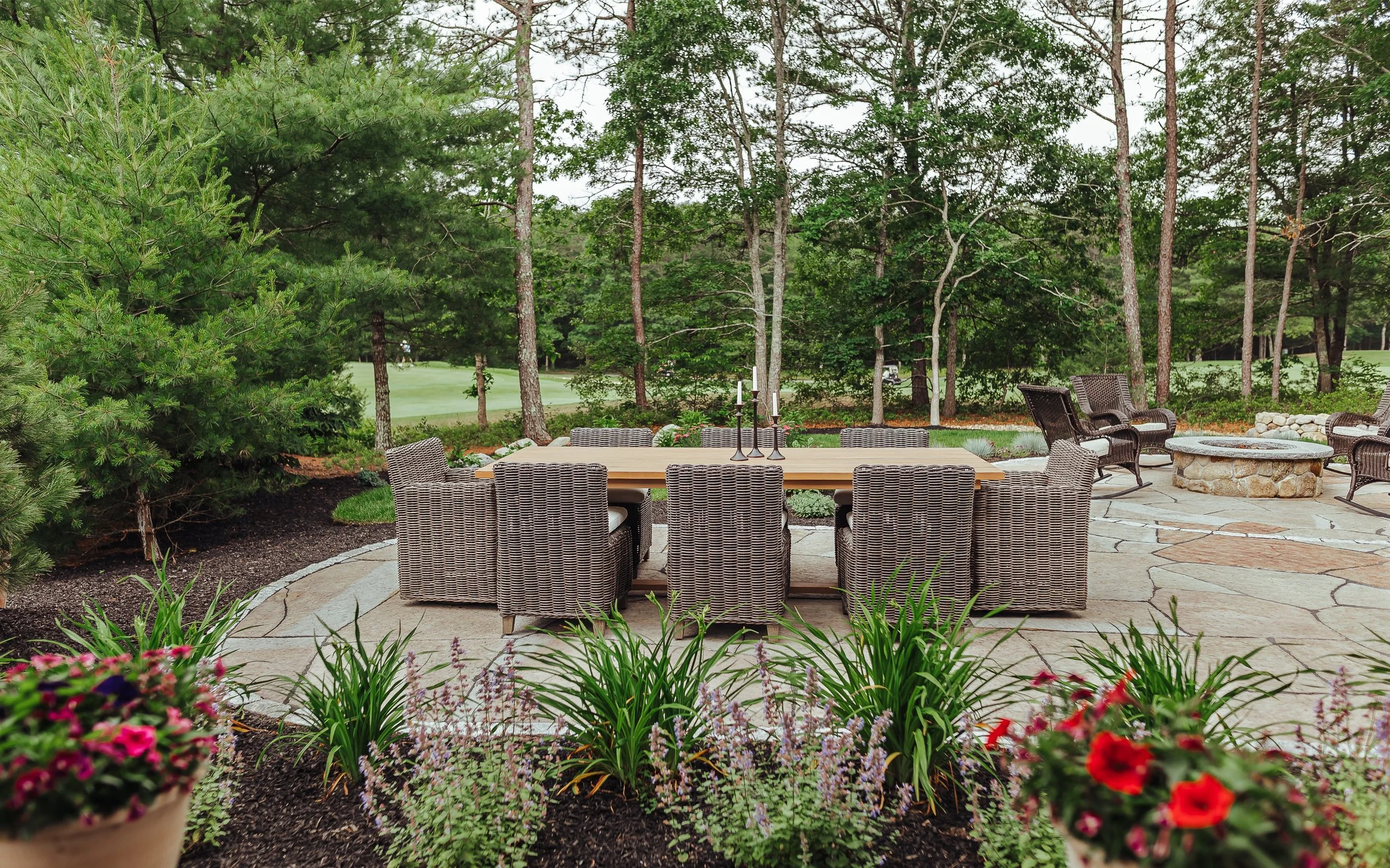 Backyard patio design with seating area in Plymouth, MA