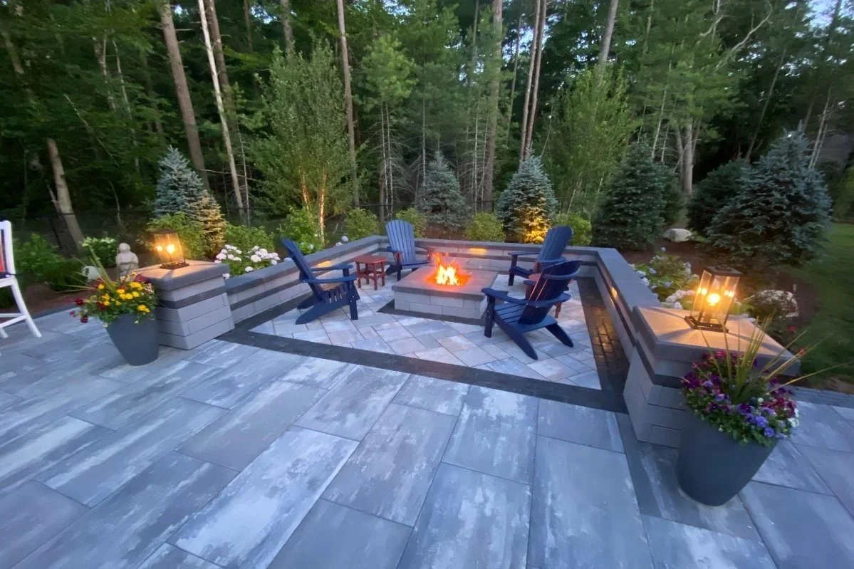 Fire Pit Lounge of wooded lot backed up by evergreens