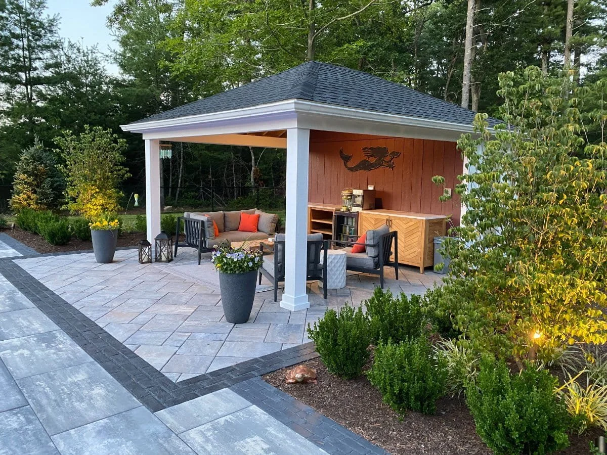 Cabana showing unified pavers creates a backyard retreat