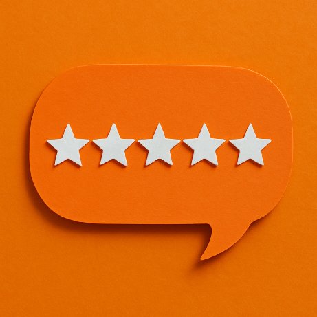 Orange speech bubble cutout with five white stars inside it, placed on an orange background.