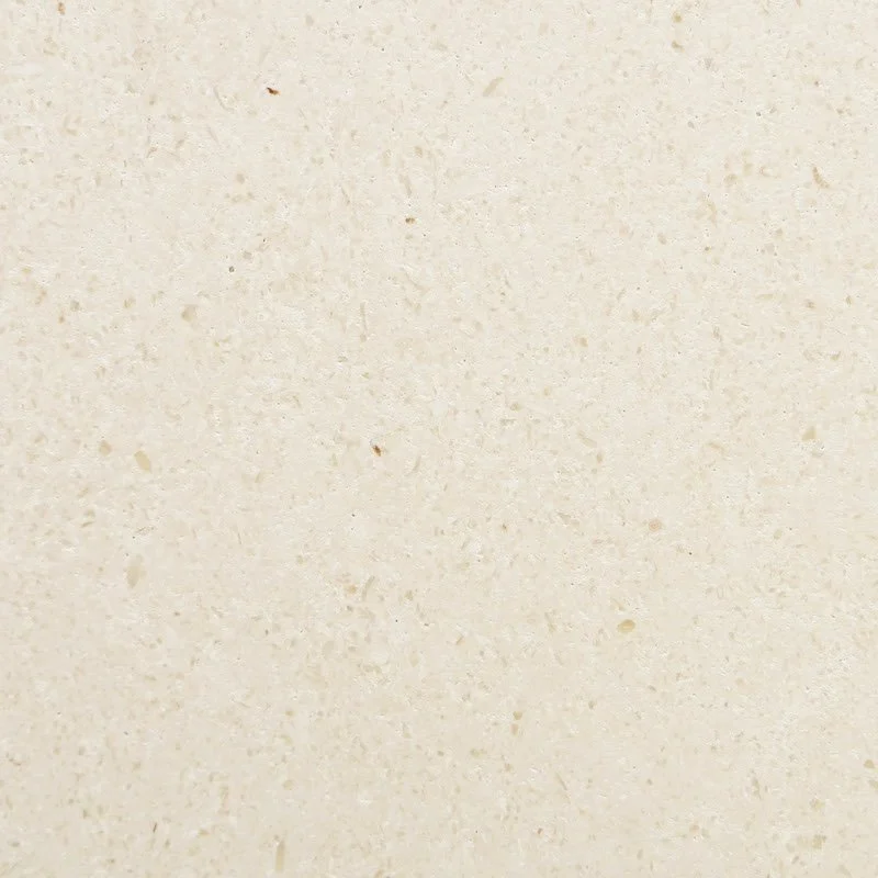Close-up of a beige, textured surface, possibly paper or fabric.