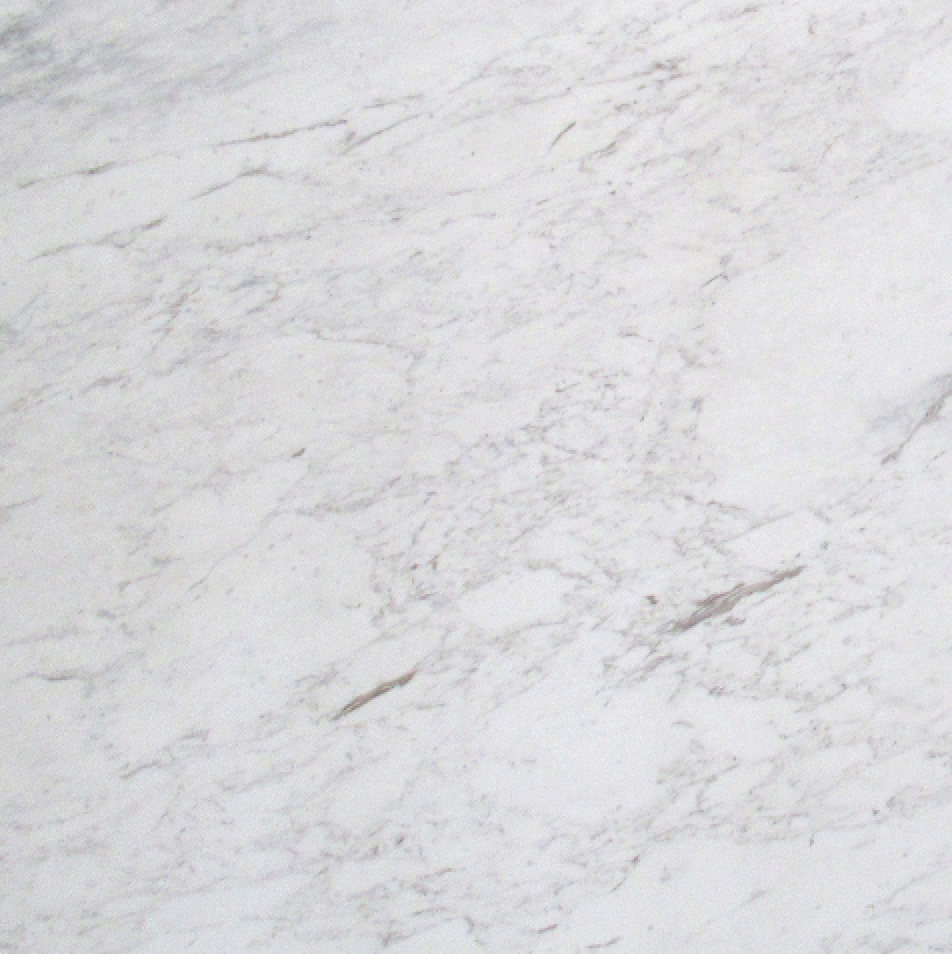 Close-up of a white marble surface with gray veining.