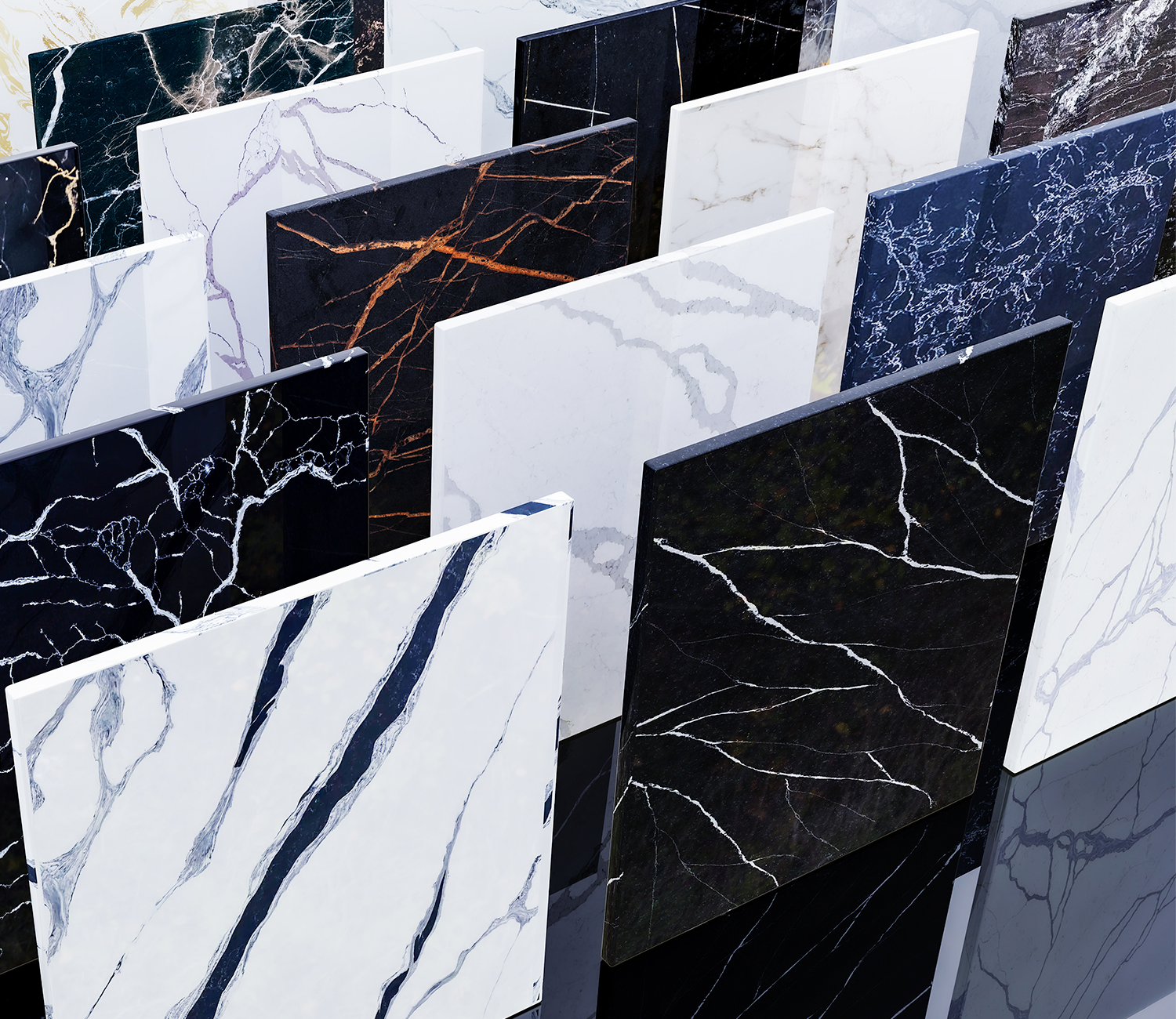 A display of marble or granite slabs with various colors and veining patterns.