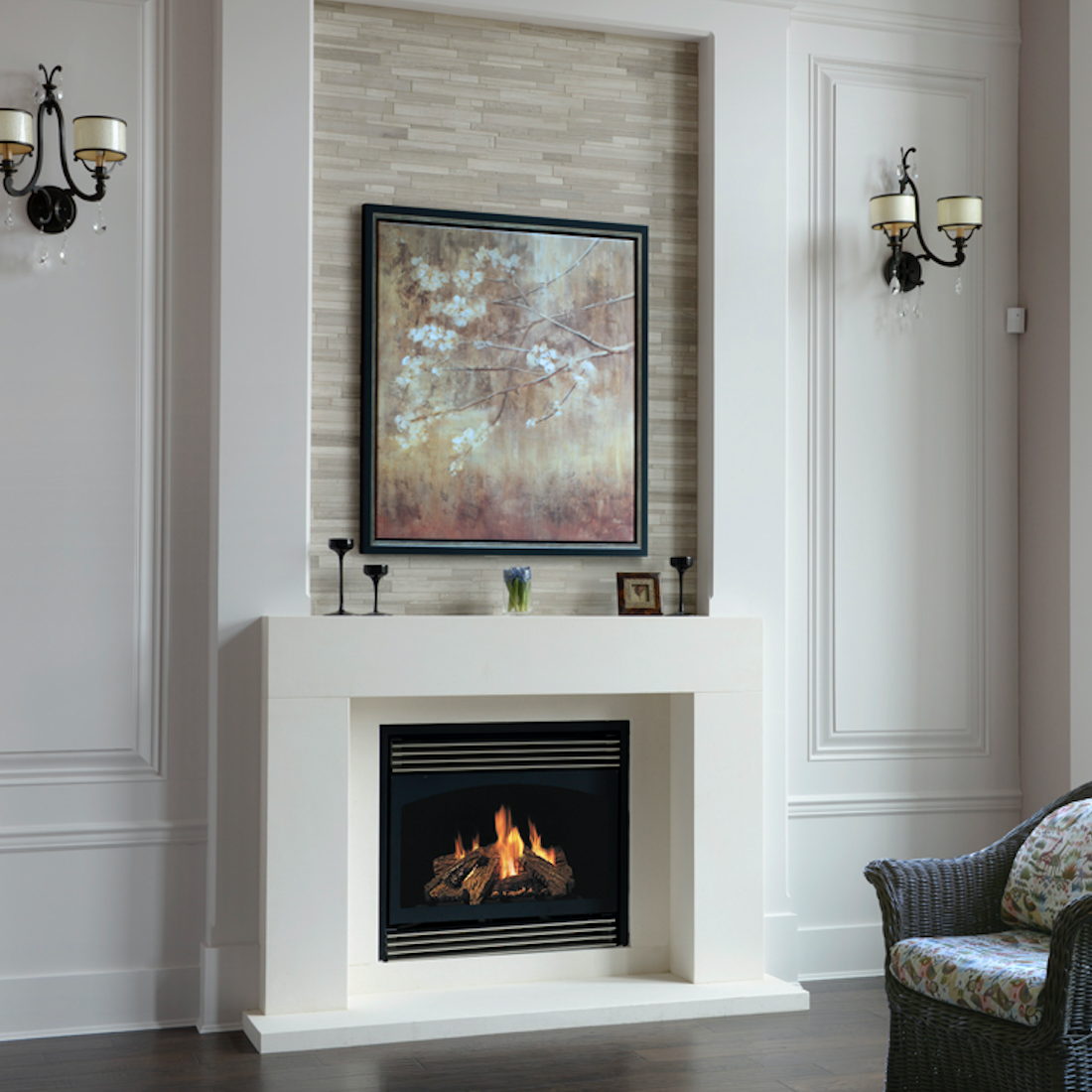 Living room with a white fireplace, a painting above it, and two wall sconces on either side.