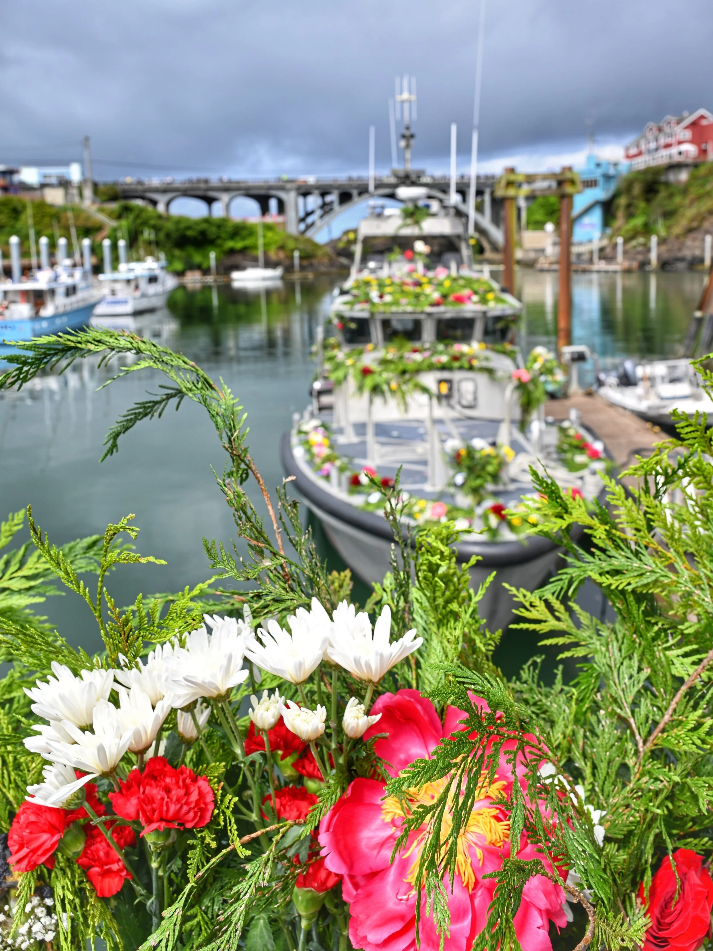 A boat and flowers in Fleet of flowers in Depoe Bay, Oregon