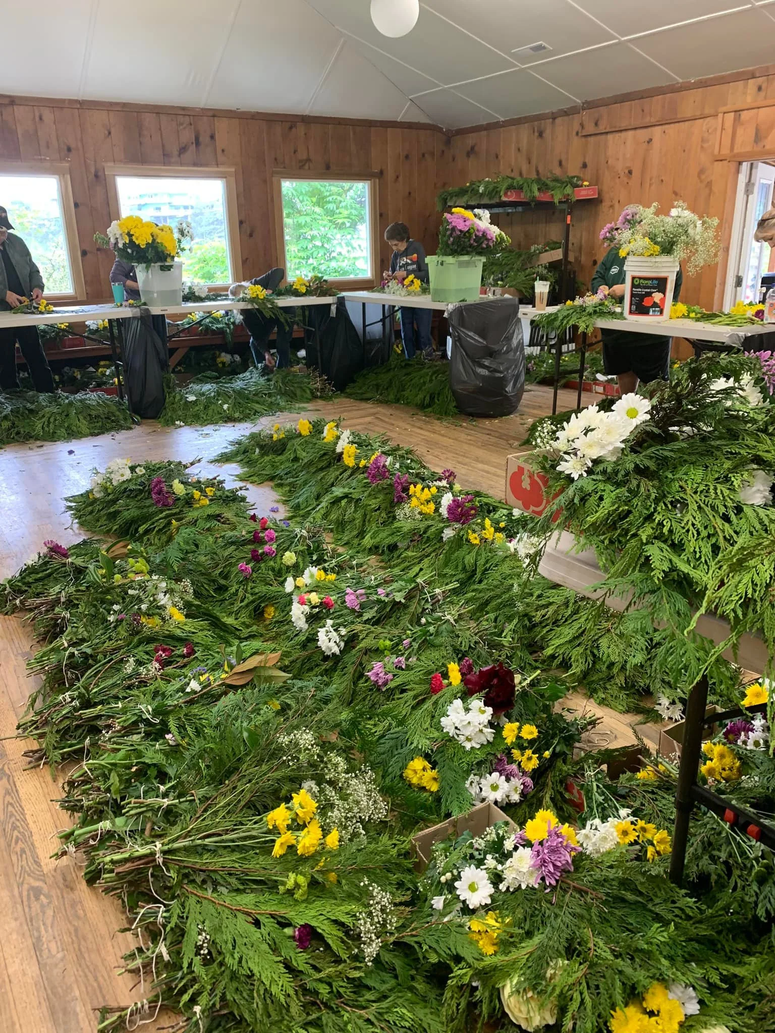 Volunteers making wreaths for the Fleet of Flowers in Depoe Bay, Oregon