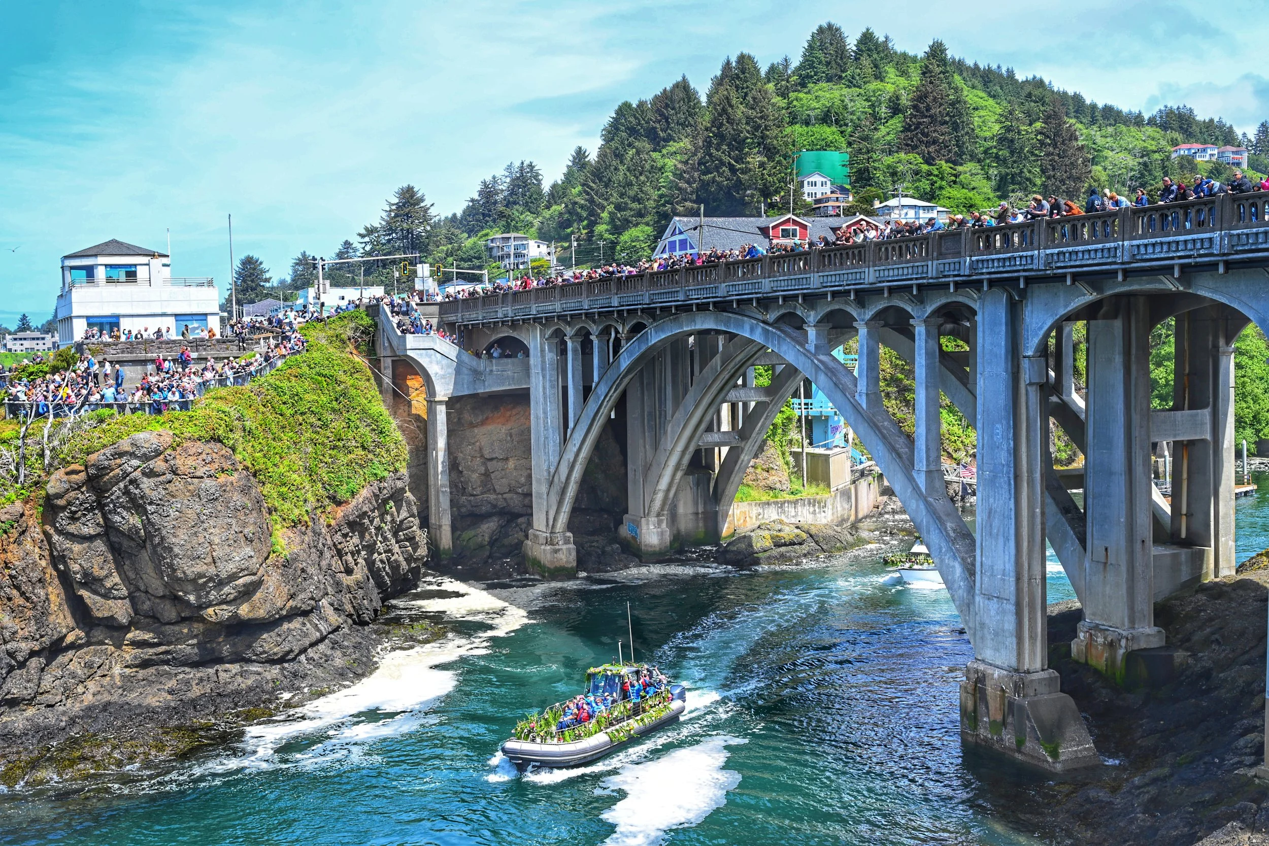 Spectators on the Depoe Bay bridge at Fleet of flowers in Depoe Bay, Oregon