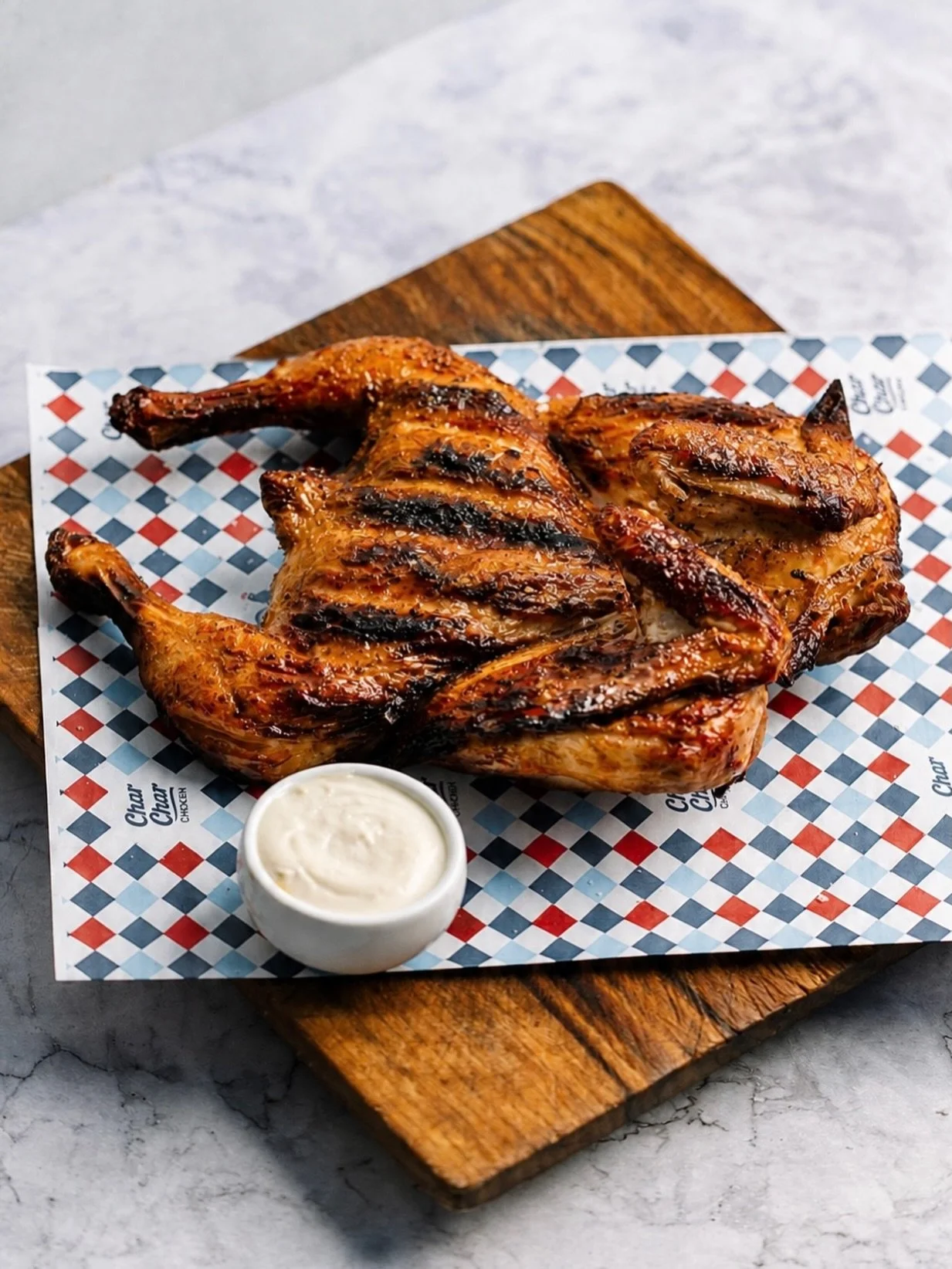 PLAN THE DAY.
GET YOUR CHARCOAL CHICKEN.

Free-range chicken, slow cooked over real charcoal for that unmistakable smoky flavour. Crispy skin, juicy meat, basted to perfection and served with our signature garlic sauce.

All for only $19.88.

Availab