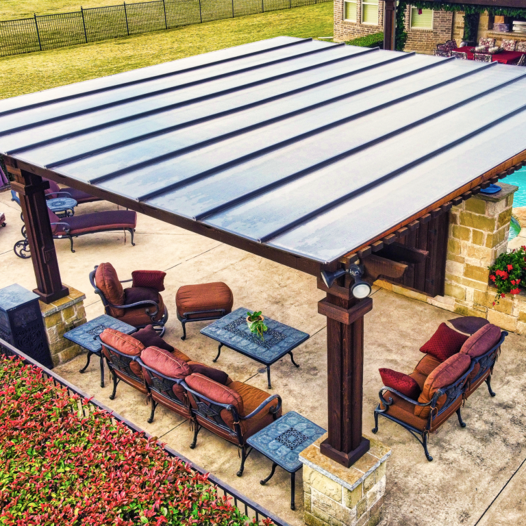 Pergola cover installation with clear roof panels allowing light while reducing heat