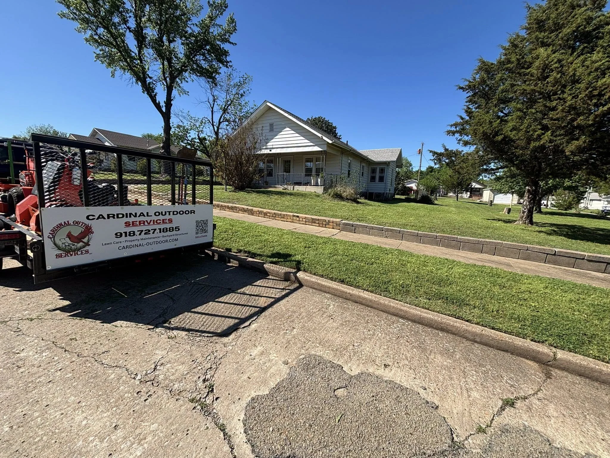 Residential lawn service completed in Drumright, helping improve curb appeal with professional mowing and trimming.