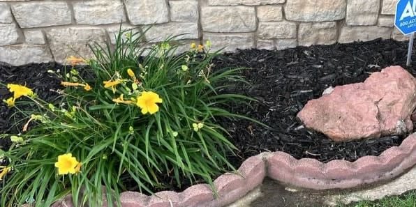 Freshly planted flowers and new mulch installation in Cushing, OK