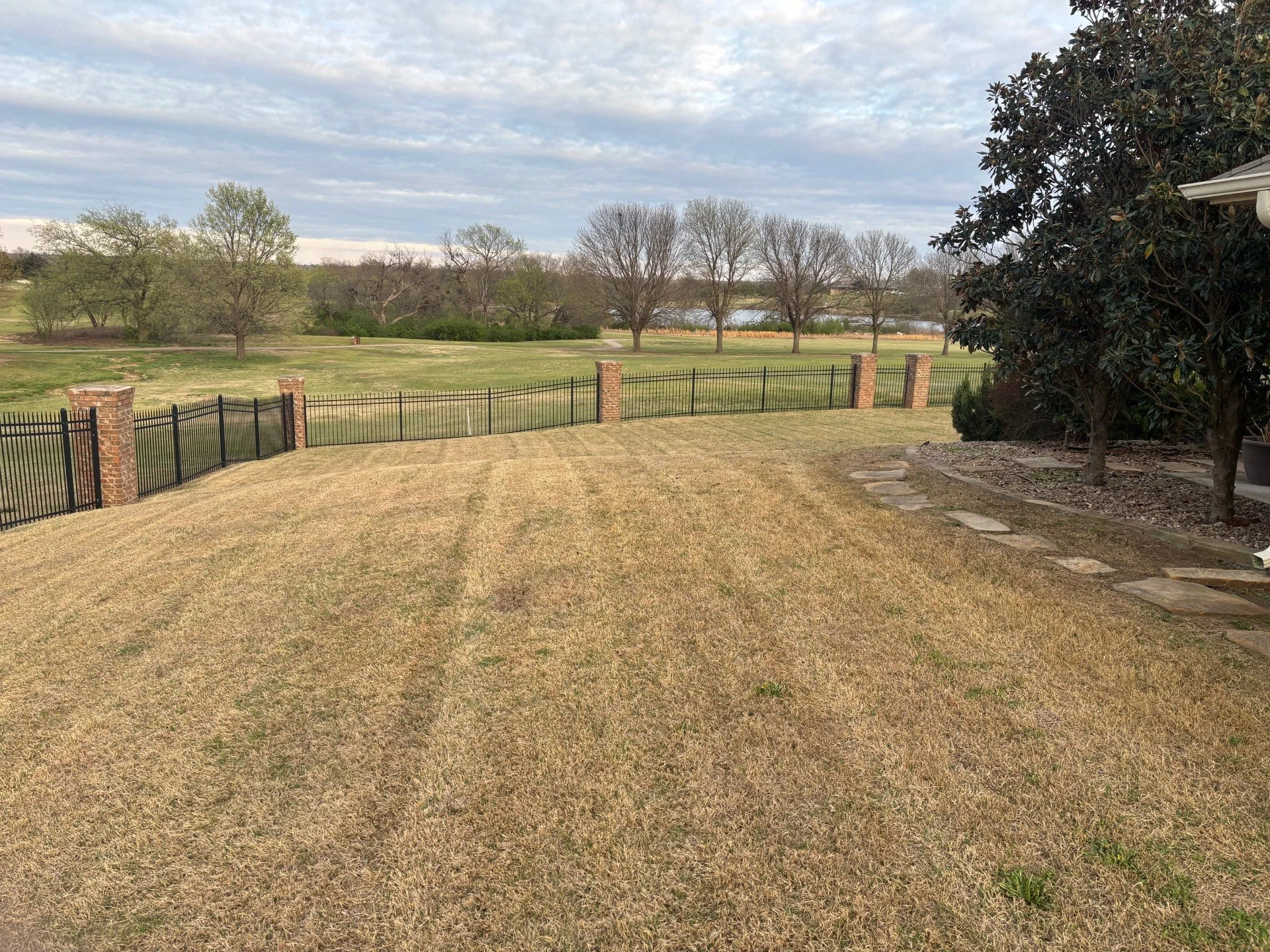 Routine lawn service in Cushing, OK – maintained residential yard with consistent weekly upkeep