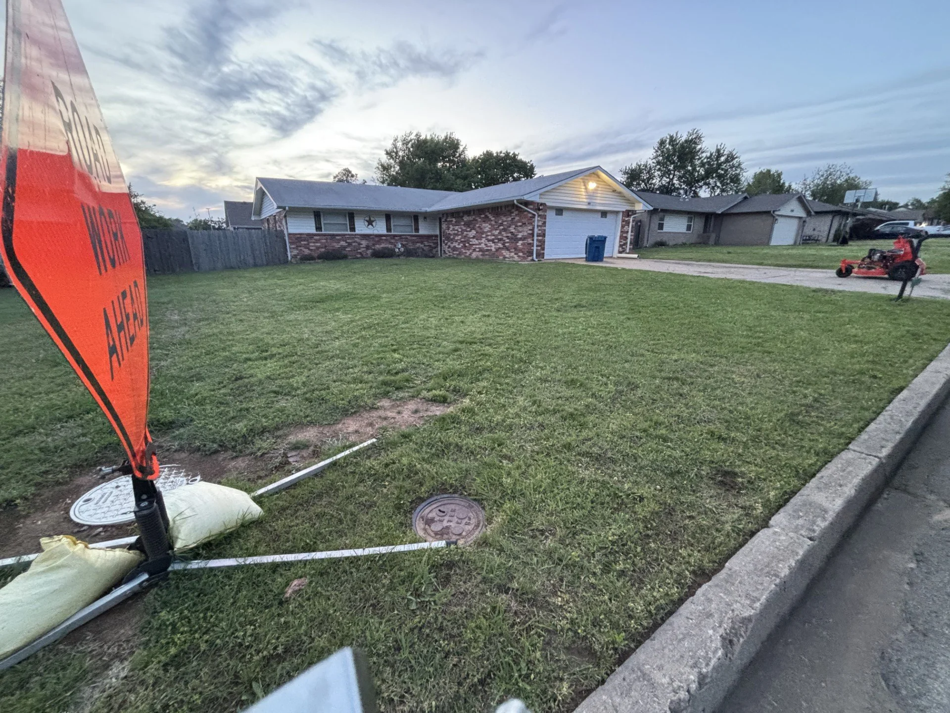 Professional lawn mowing and edging service completed on a residential property in Cushing, OK, delivering a clean and polished curb appeal finish.