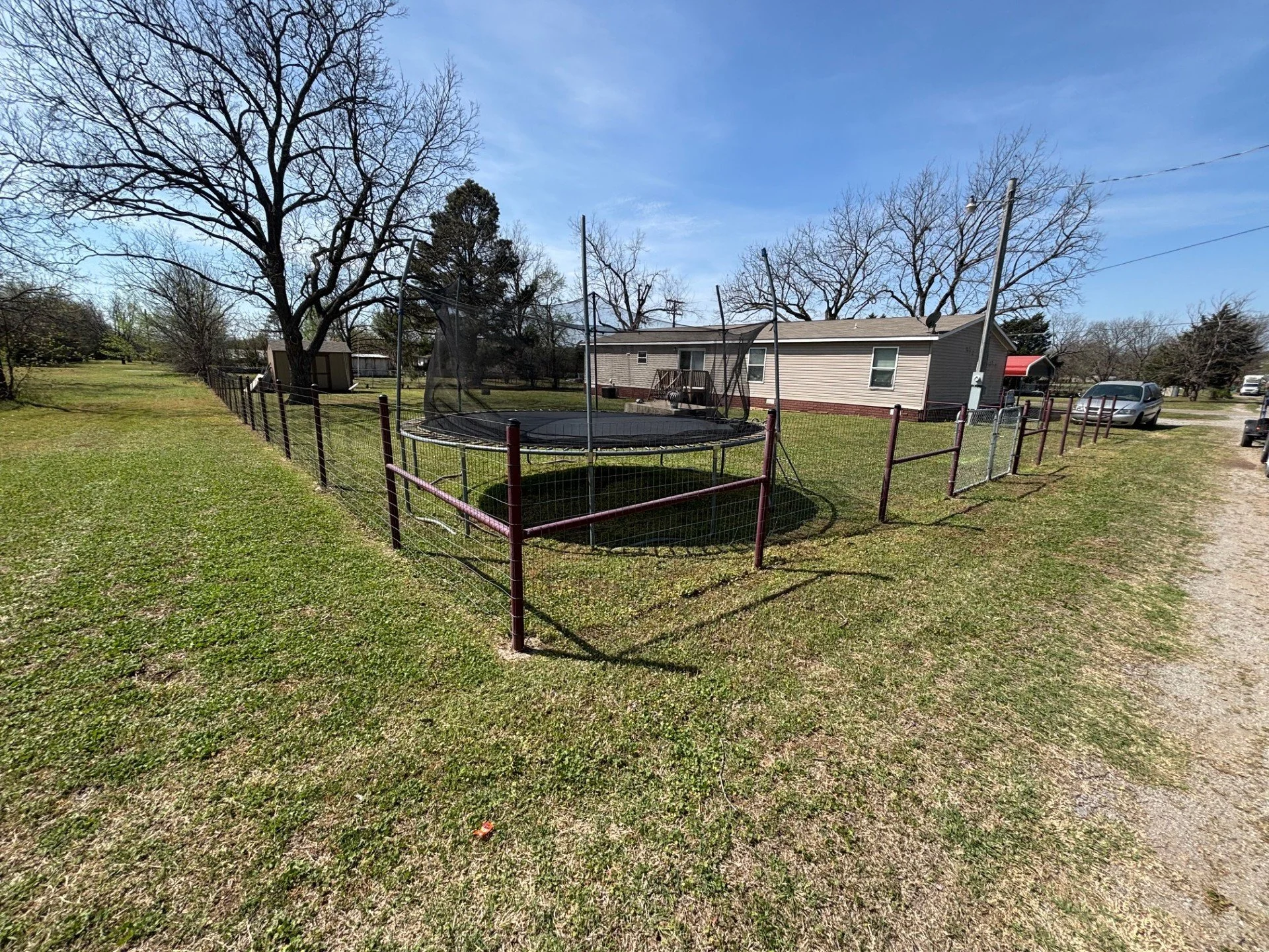 Weekly lawn care service in Cushing, Oklahoma – maintained fenced yard and residential property