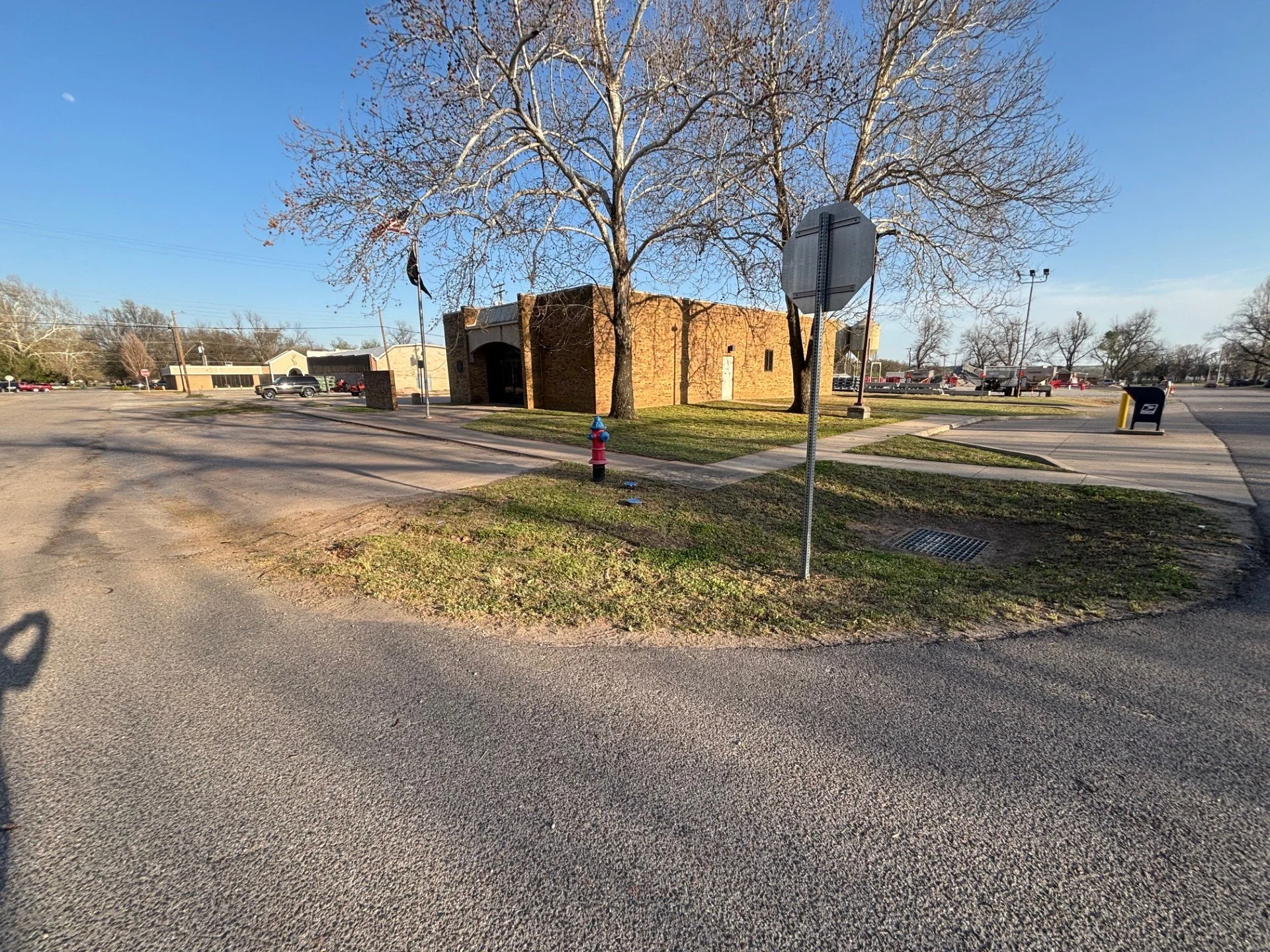 Commercial lawn maintenance in Perkins, OK – post office grounds maintained on a biweekly schedule