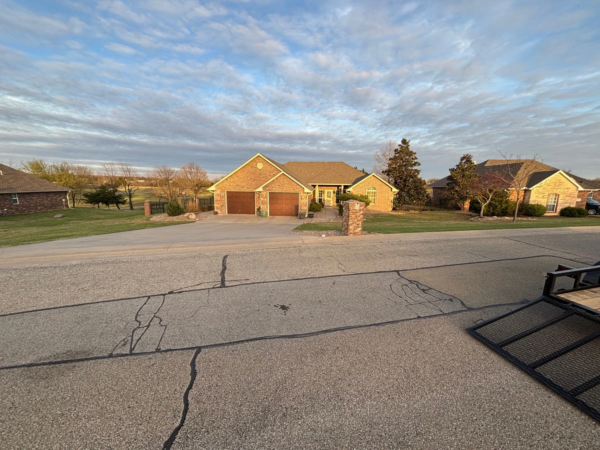 Weekly yard maintenance in Cushing, OK – trimmed grass and defined edges on residential property