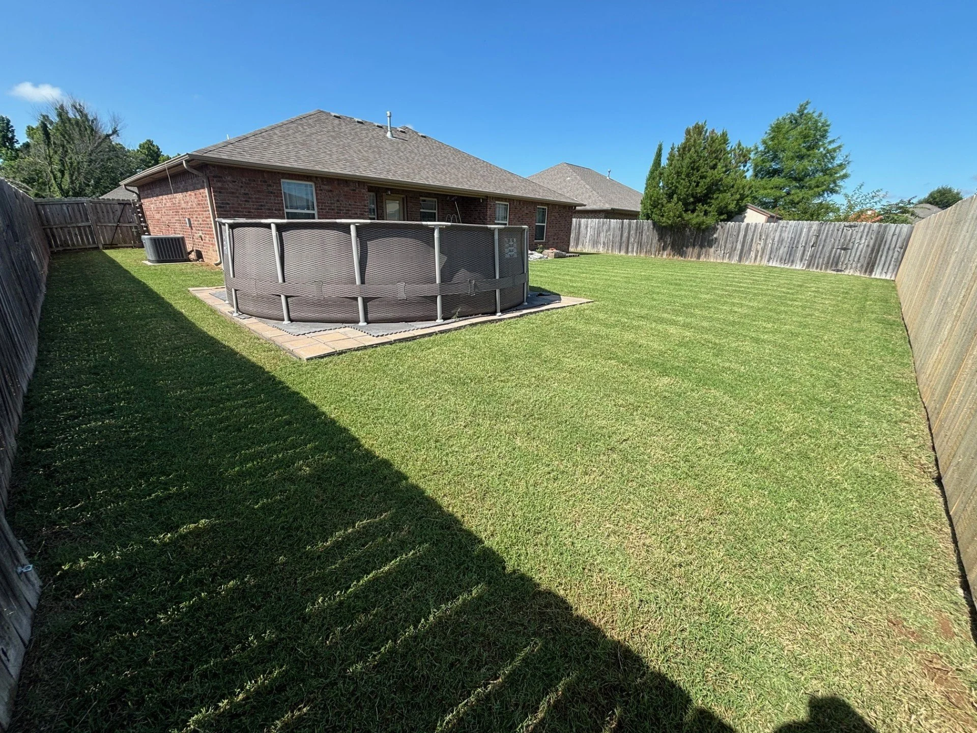 Residential lawn care in Perkins, Oklahoma, with bi-weekly mowing, edging, and trimming for a consistently clean and maintained yard.