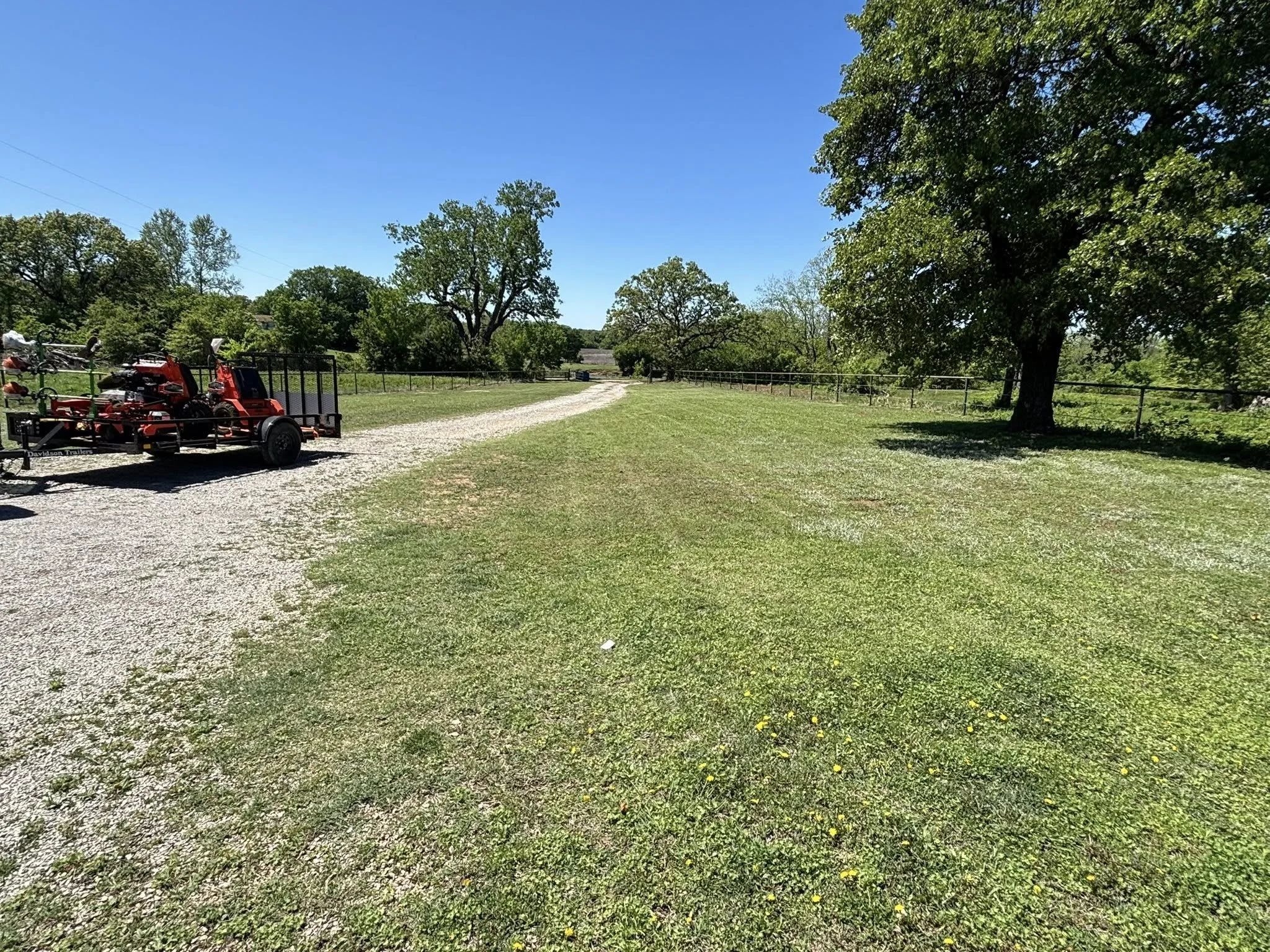 Residential lawn service completed in Drumright, helping improve curb appeal with professional mowing and trimming.