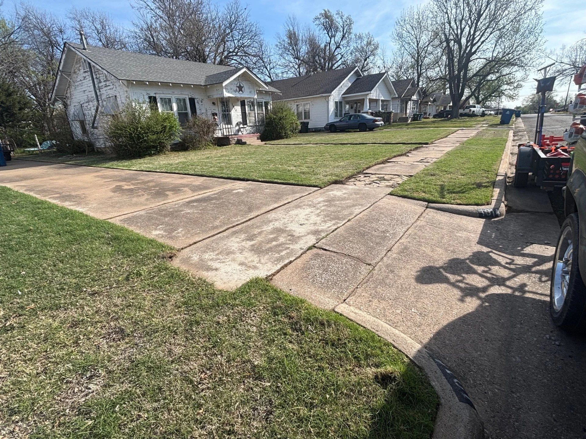 Weekly lawn care service in Cushing, Oklahoma – residential property maintained with clean mowing and edging