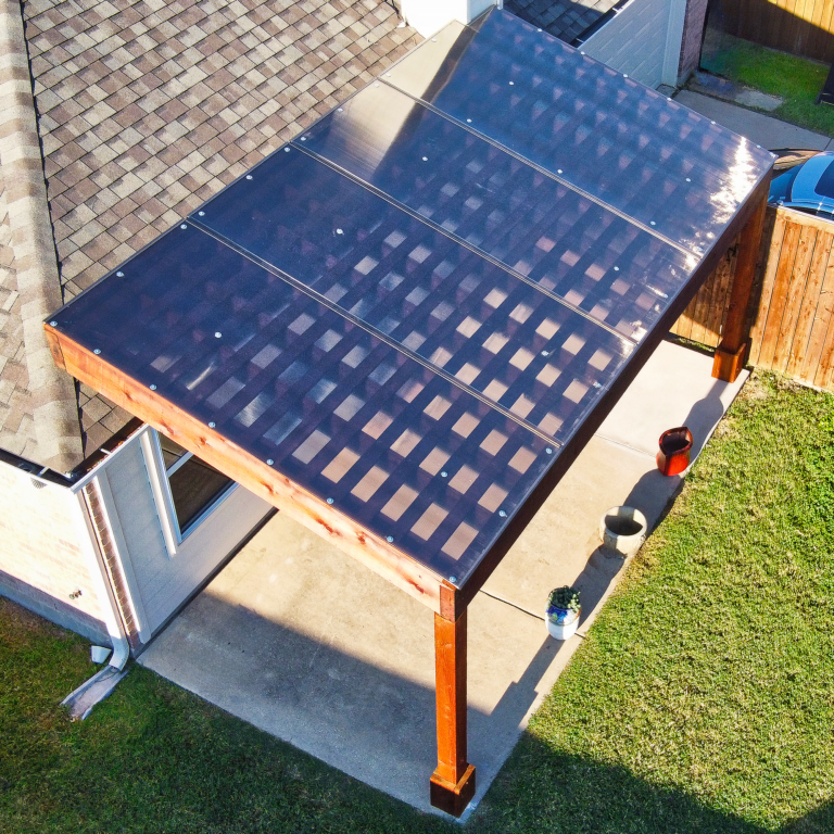 Backyard pergola upgraded with cover system for improved comfort and usability