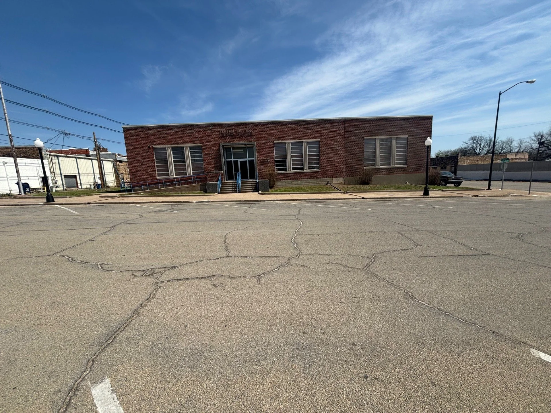 Professional lawn care in Cushing, Oklahoma – maintained post office property and surrounding grounds