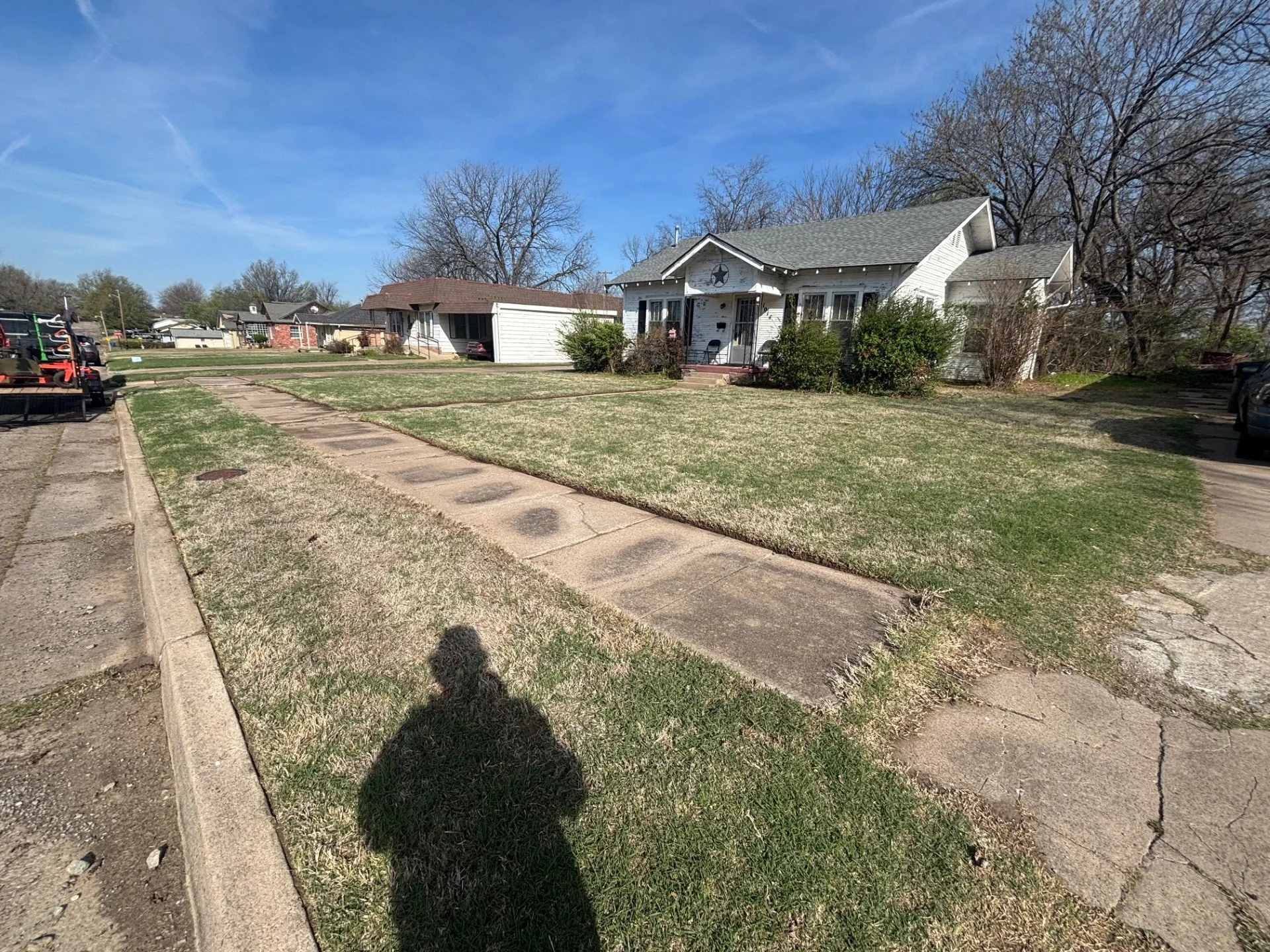 Weekly lawn care service in Cushing, Oklahoma – residential property maintained with clean mowing and edging
