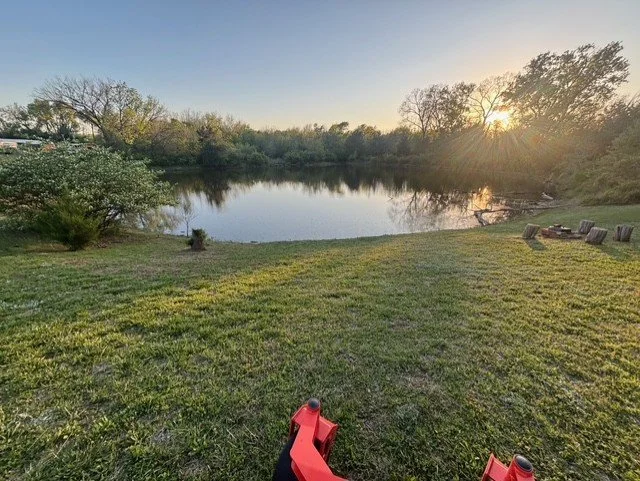 Lawn maintenance around pond and landscape features, maintaining a clean and natural appearance.