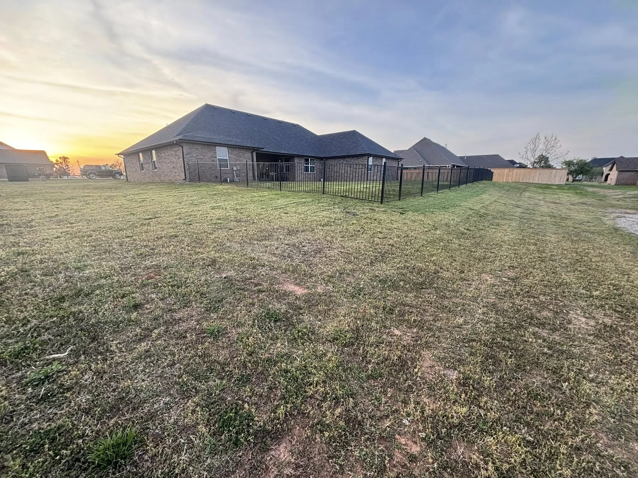 Residential lawn maintenance in Stillwater, OK – large backyard maintained on a biweekly schedule with pet waste removal service