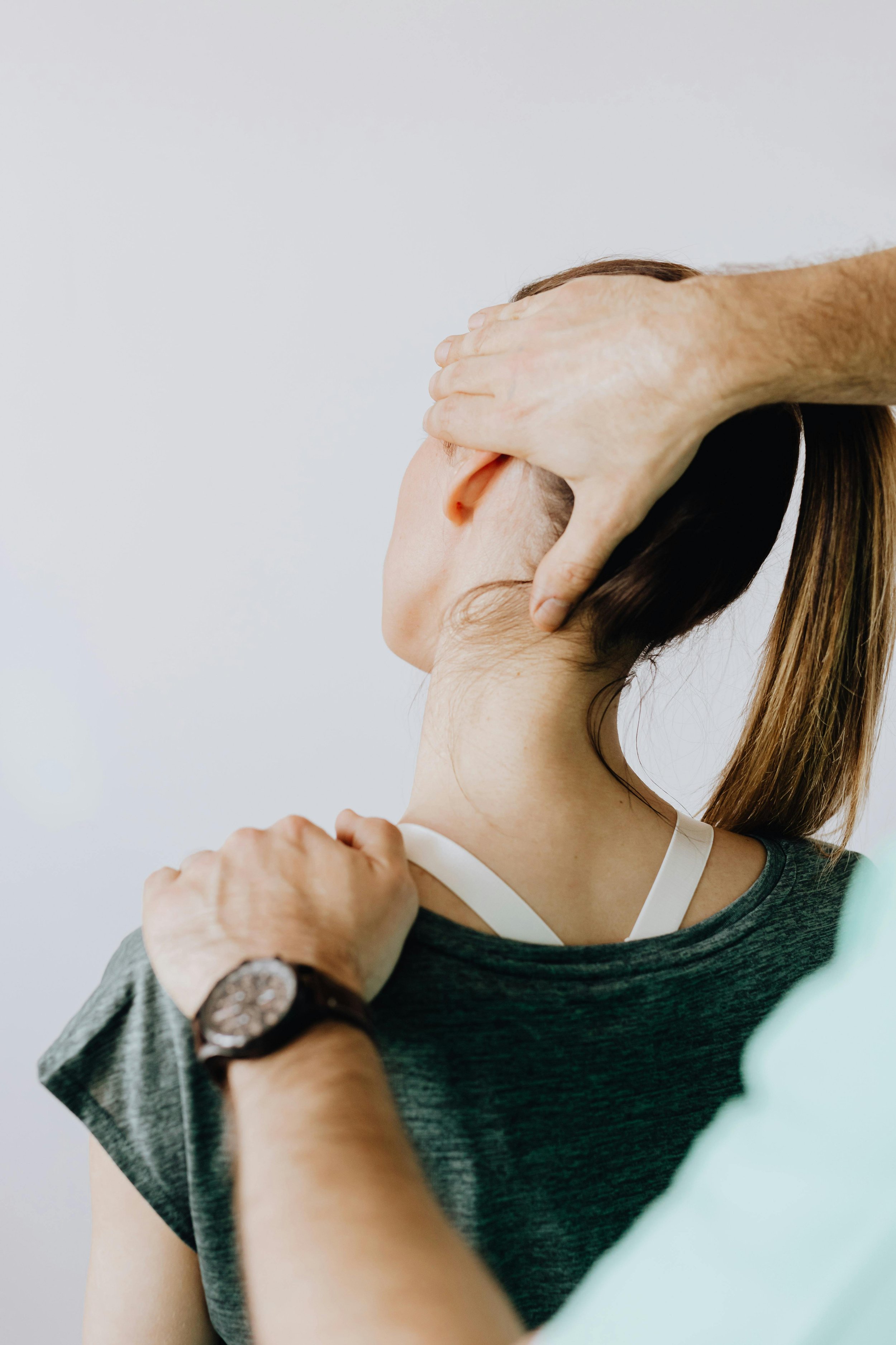 Woman having a chiropractic neck adjustment eltham chiropractor by shambrook family chiropractic