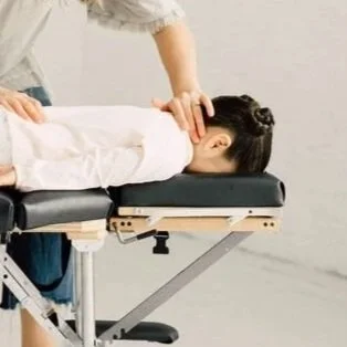 A young girl having a chiropractic adjustment