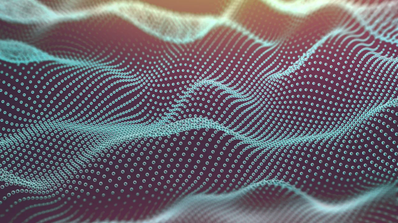 A digital abstract background with a 3D wave pattern of small bright dots on a dark surface.