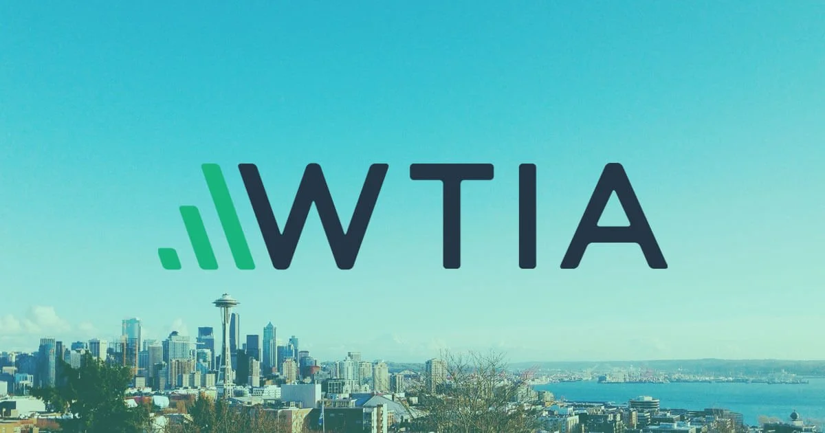 Seattle skyline with the Space Needle and city buildings, overlaid with the WTIA logo.