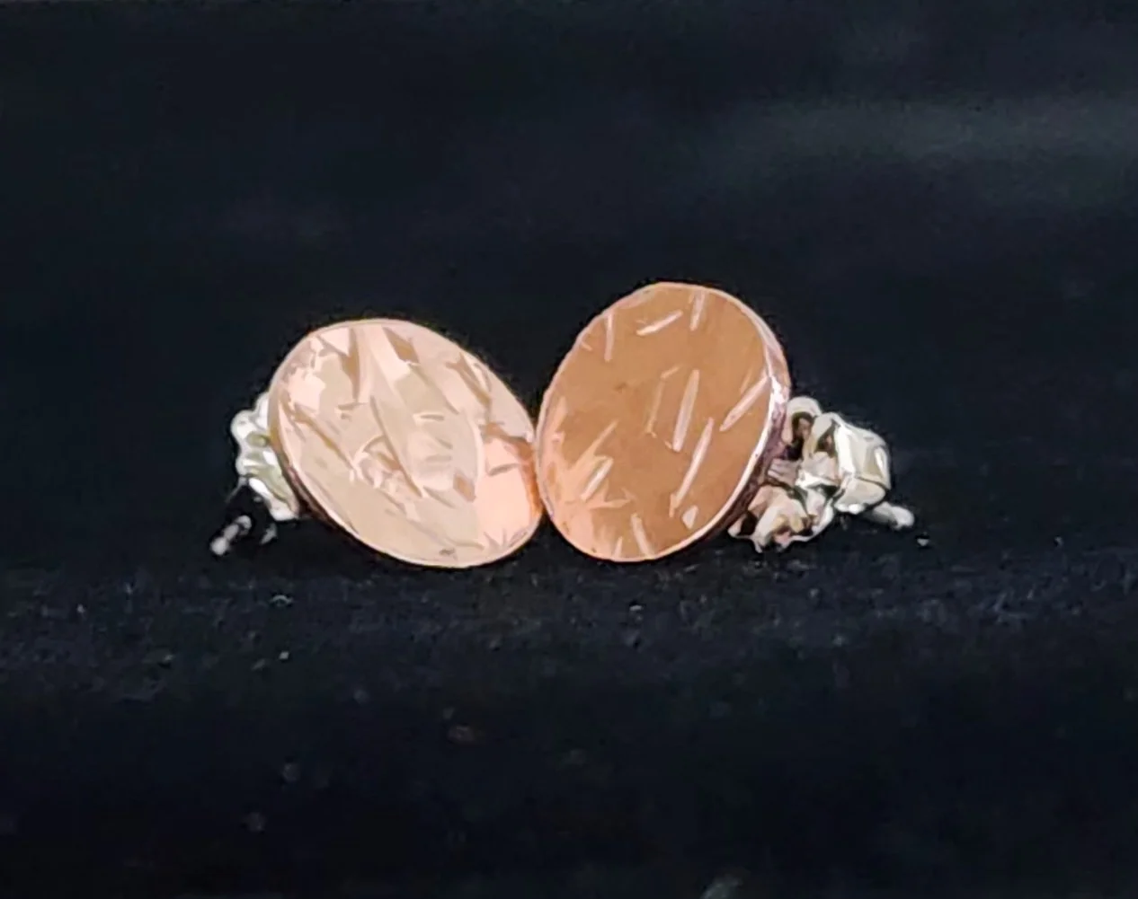 Copper shiny round textured earrings close up 2.jpg