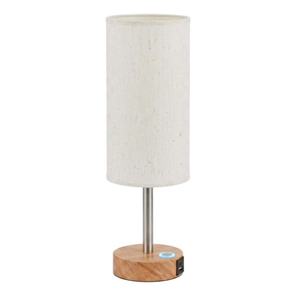 A modern table lamp with a cylindrical fabric shade, a wooden base, and a metal stem, featuring a touch control and USB port on the base.