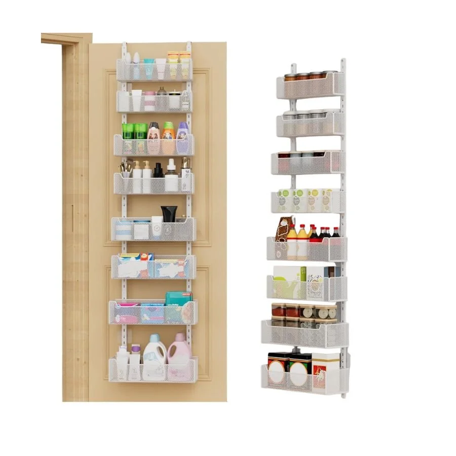Two vertical storage racks with white mesh baskets containing various household items such as cleaning supplies, bottles, jars, and cans, mounted on a beige wall and standing beside a wooden door frame.