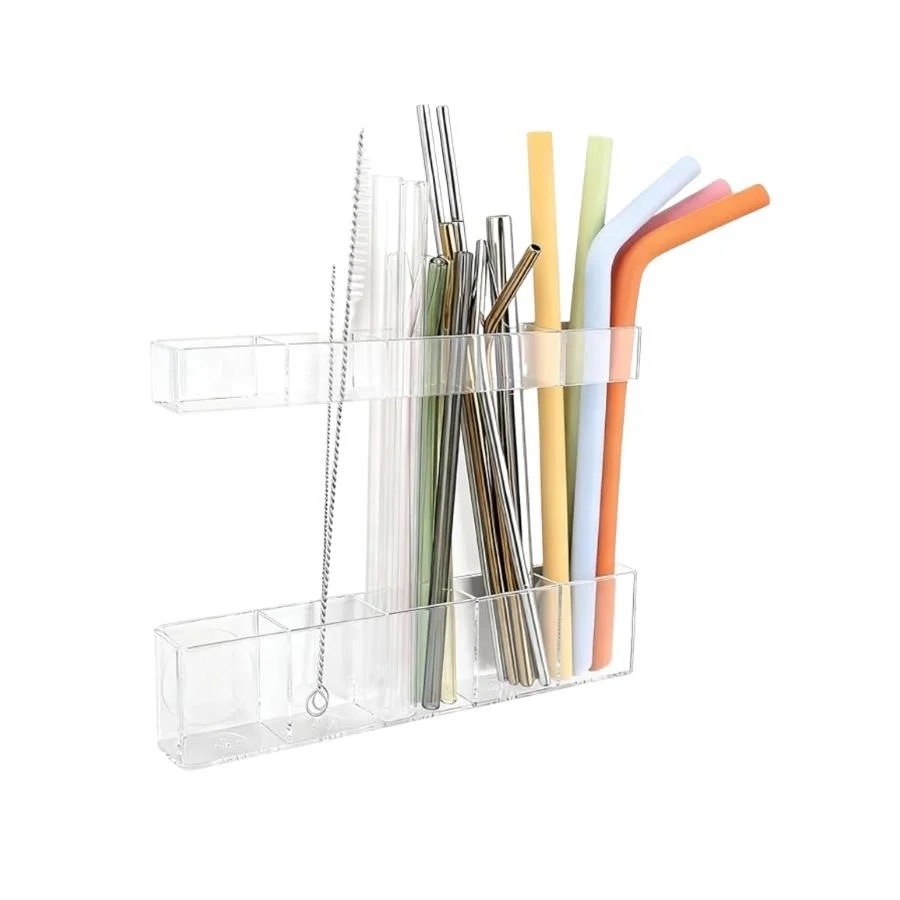 Clear plastic organizer holding reusable metal and plastic straws with multiple colors.
