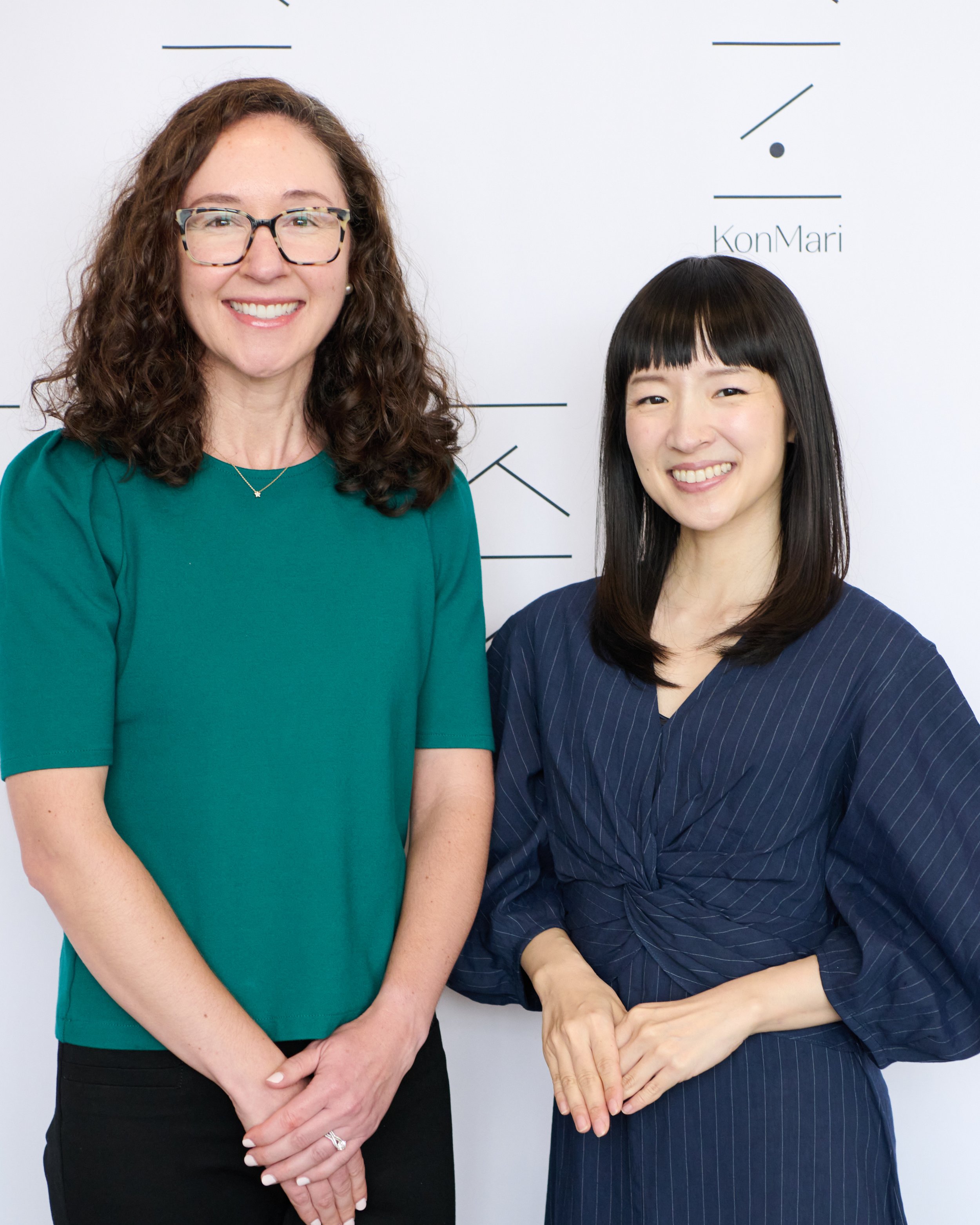 Two women (Marie Kondo and Nicole Kransz) standing side by side, smiling.