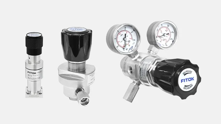 Three pressure regulators with gauges, one small, one medium, and one large, all labeled FITOK, on a white background.