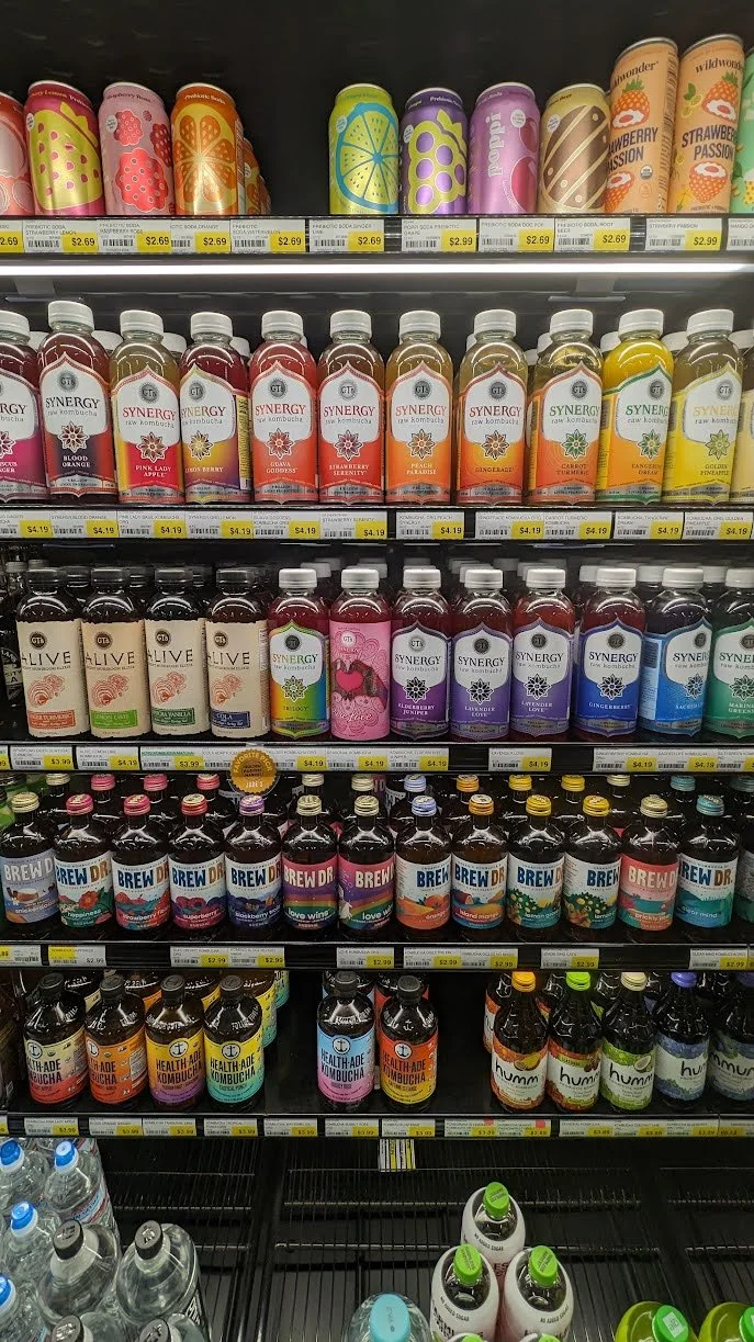 Kombucha cooler featuring a variety of brands.