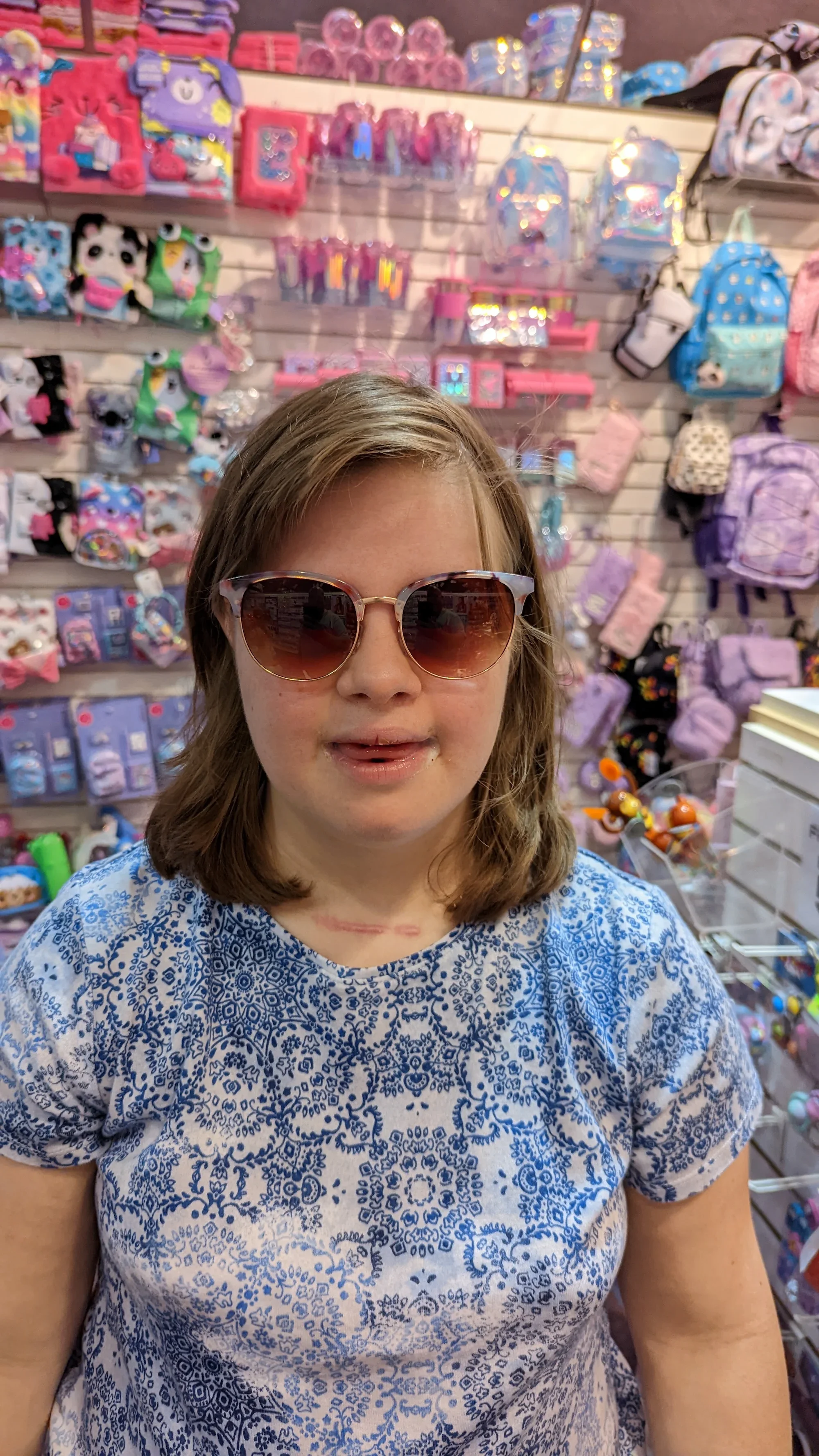 Annaka Paige in her favourite sunglasses, laughing with the sun, feeling life. Portrait of pure joy. #BeautifulSoul #DownSyndrome #Kindness #RealLife #SEOdoneRight.