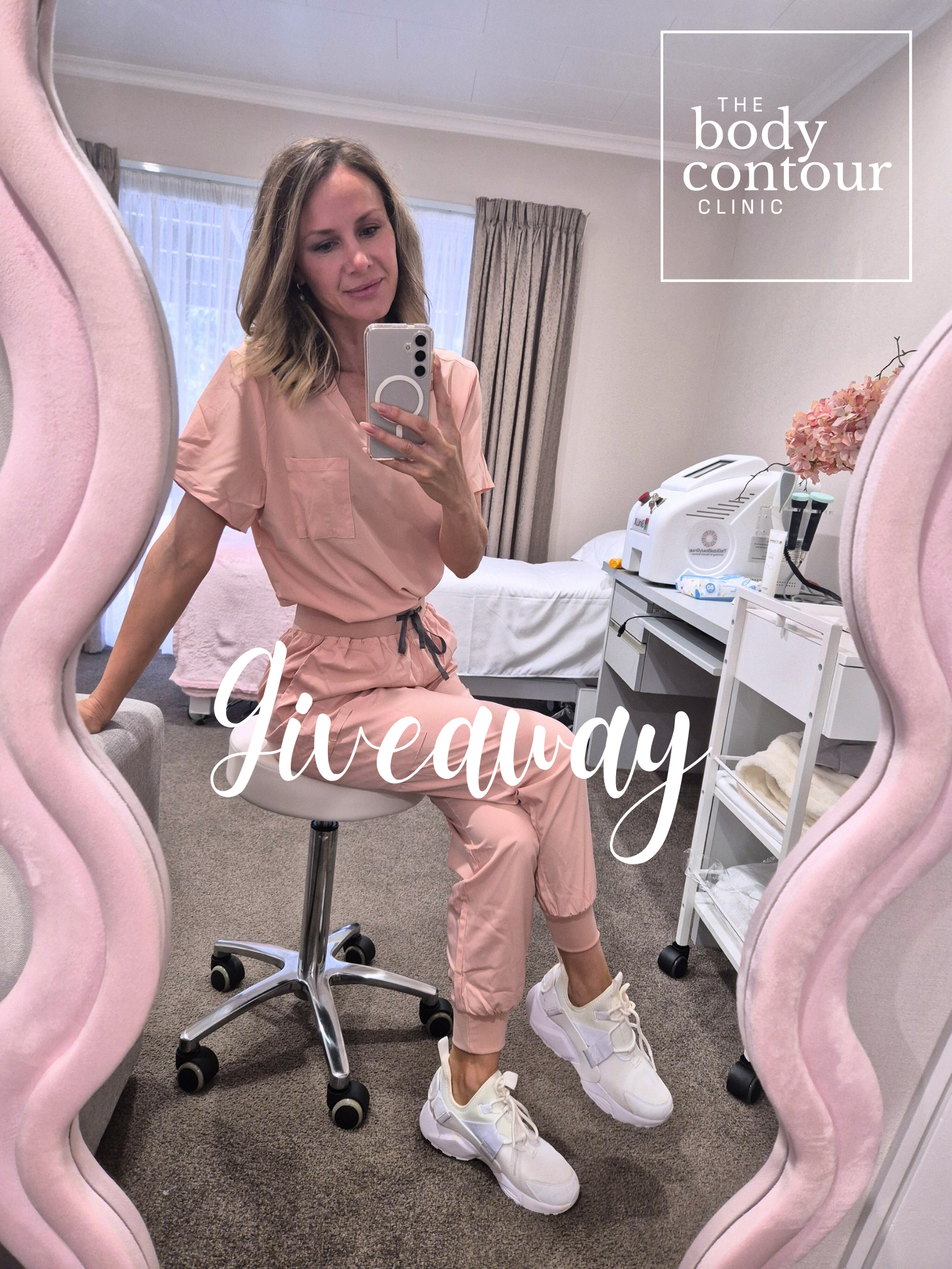 A woman in pink medical scrubs taking a mirror selfie in a clinic room, with text overlay saying 'giveaway' and a logo for 'The Body Contour Clinic'.
