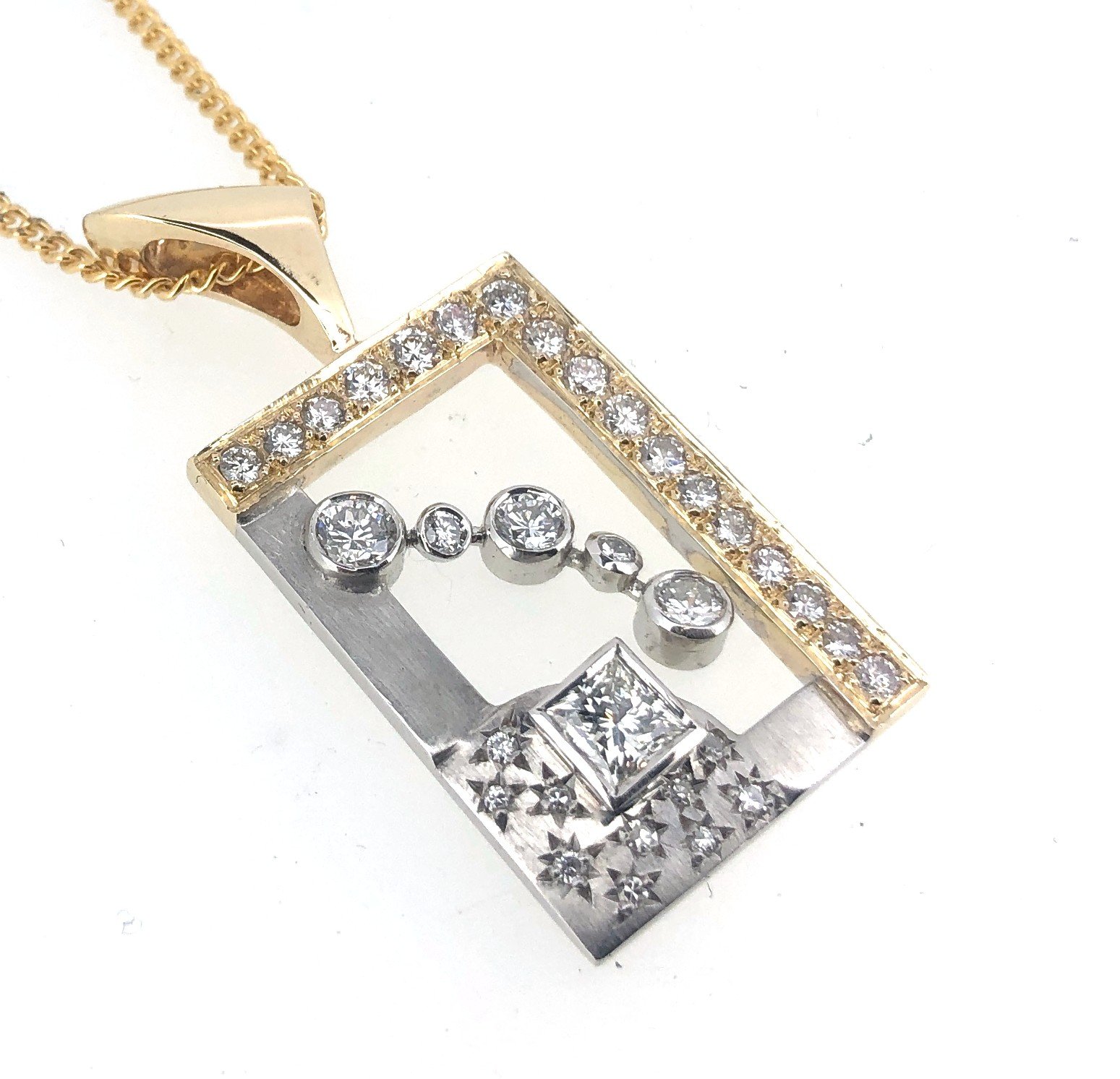 Close-up of gold and silver jewelry pieces with diamond accents
