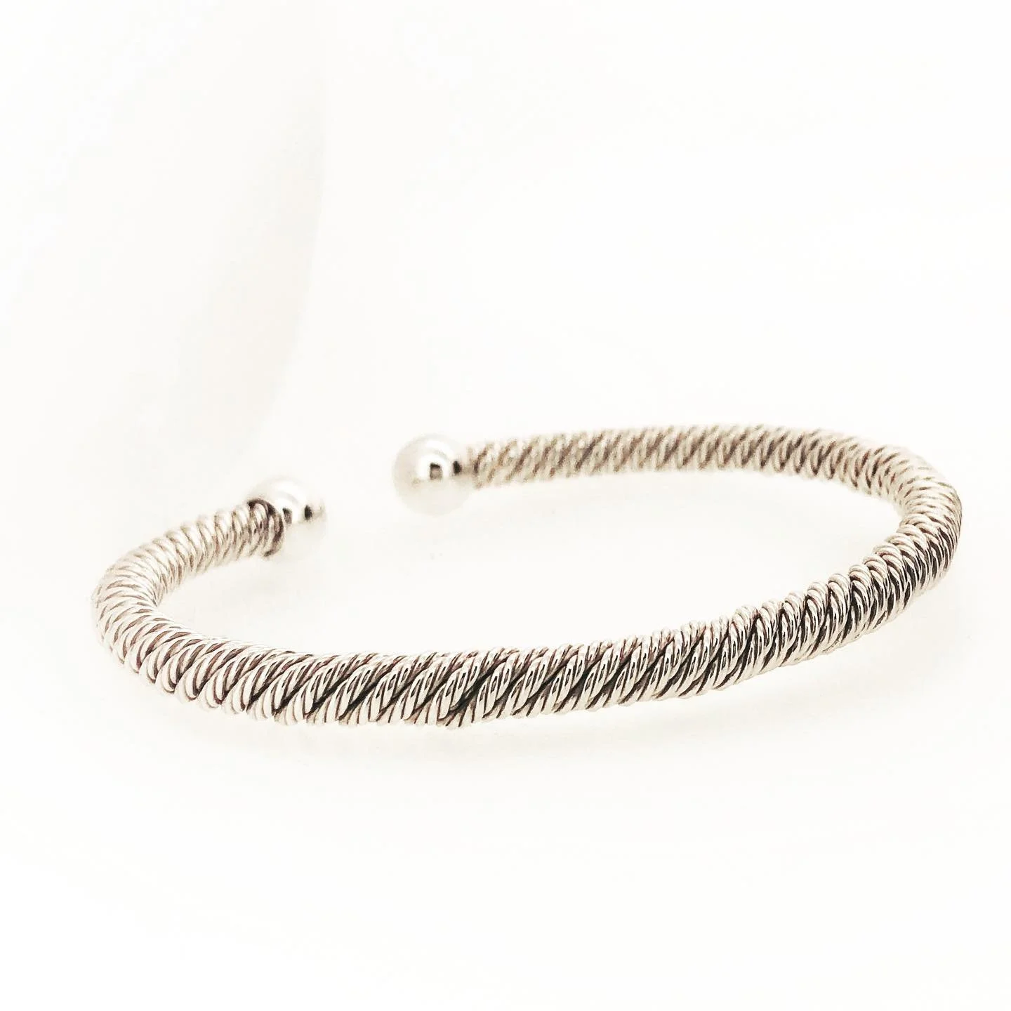 Silver twisted rope bracelet with small silver balls at each end