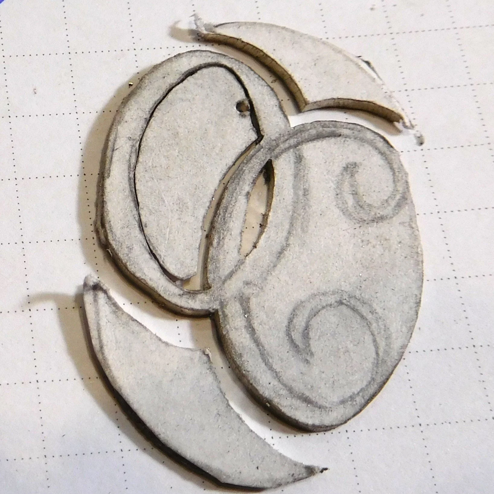 Hand-cut white gold initial components for a bespoke monogram pendant