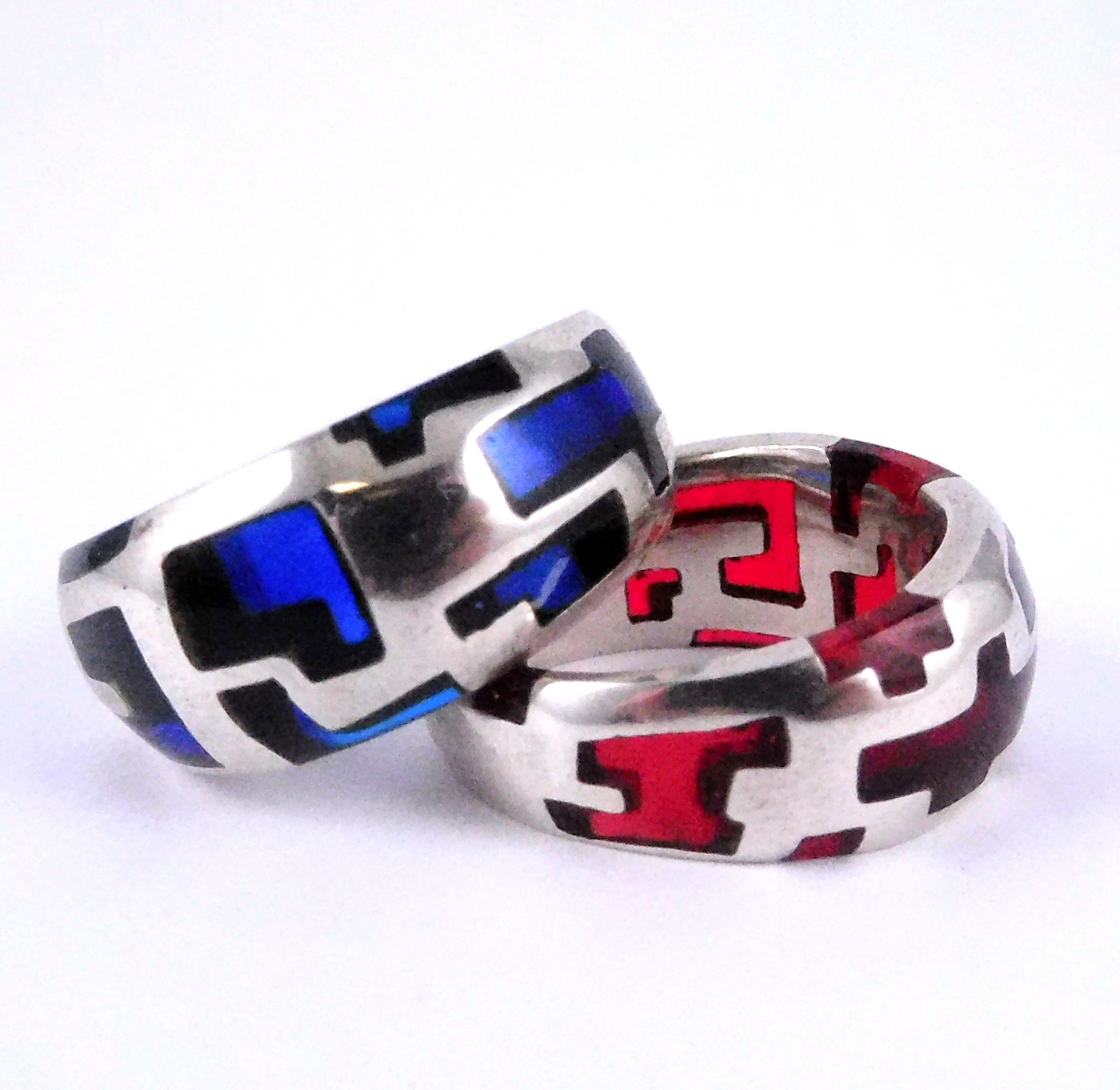 Two colourful resin and silver rings. 