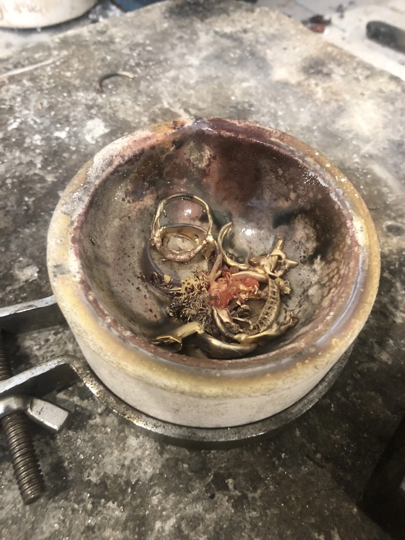 Scrap gold about to be melted. 
