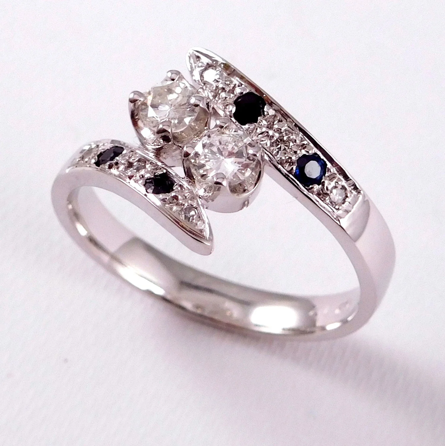 White gold ring with diamonds and sapphires. 