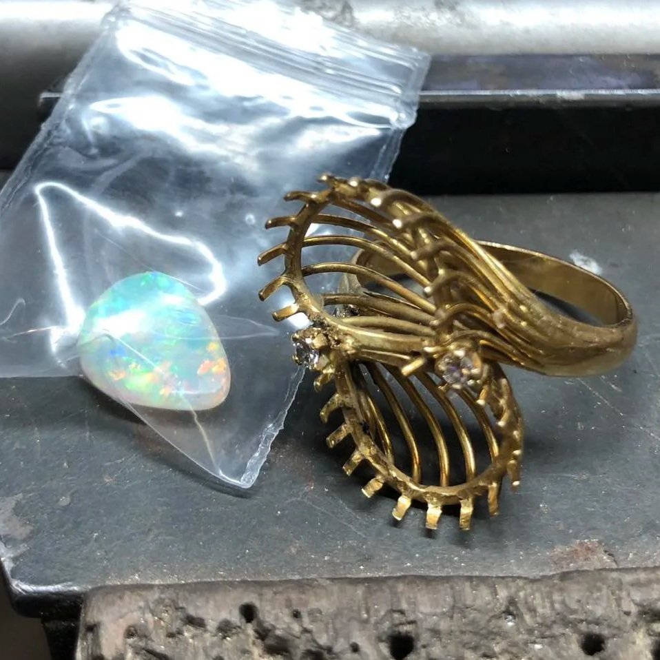 Damaged opal ring before remodelling into a pendant