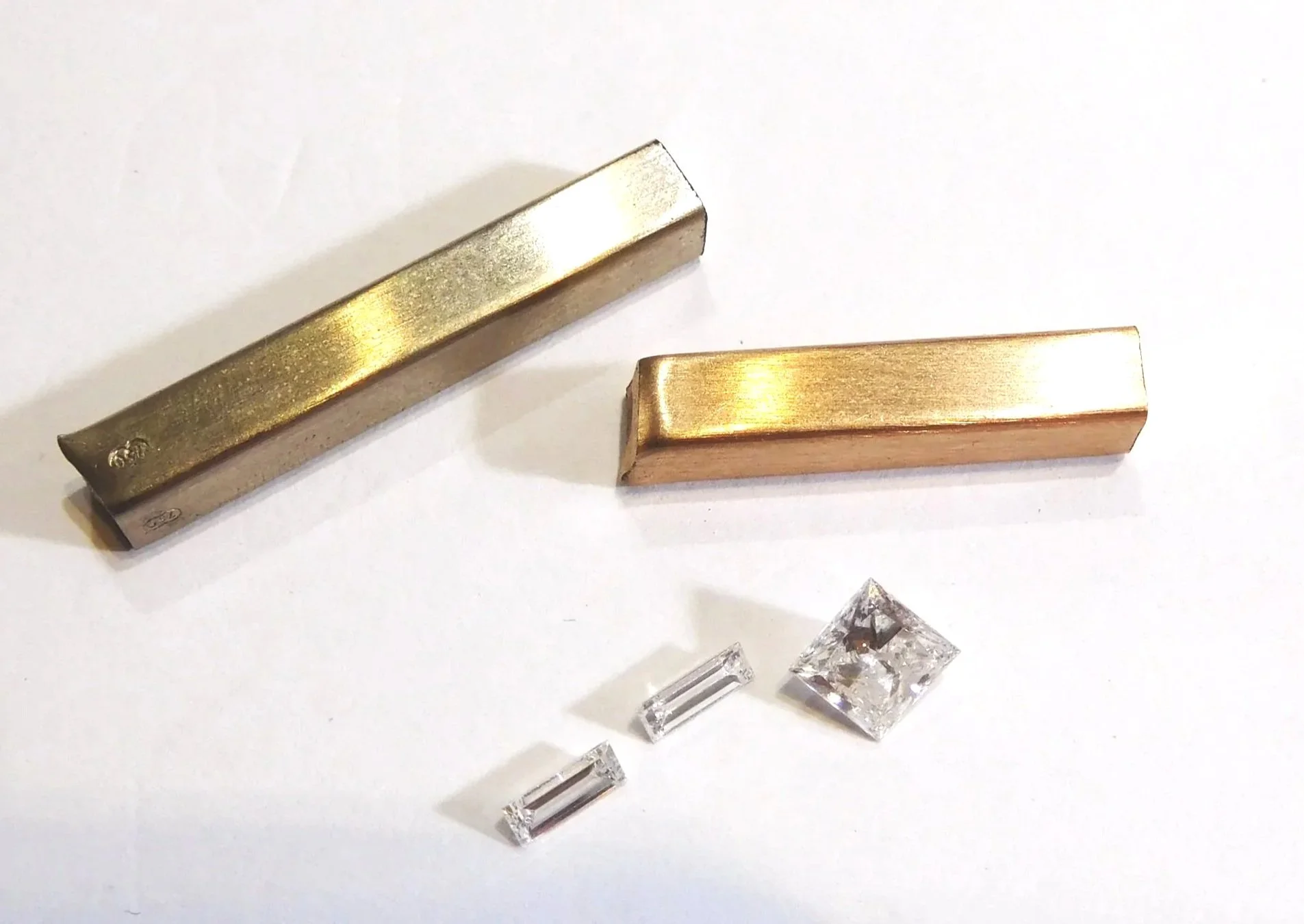 Rose gold and white gold stock with princess-cut and baguette diamonds for a custom engagement ring